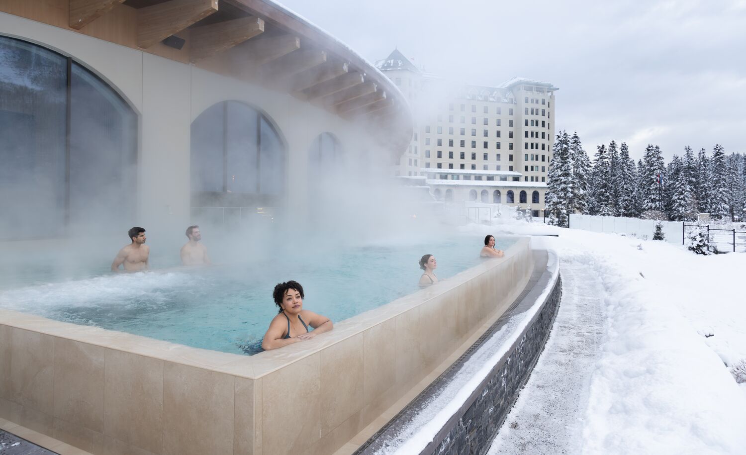 People in an outdoor swimming pool in Banff National Park