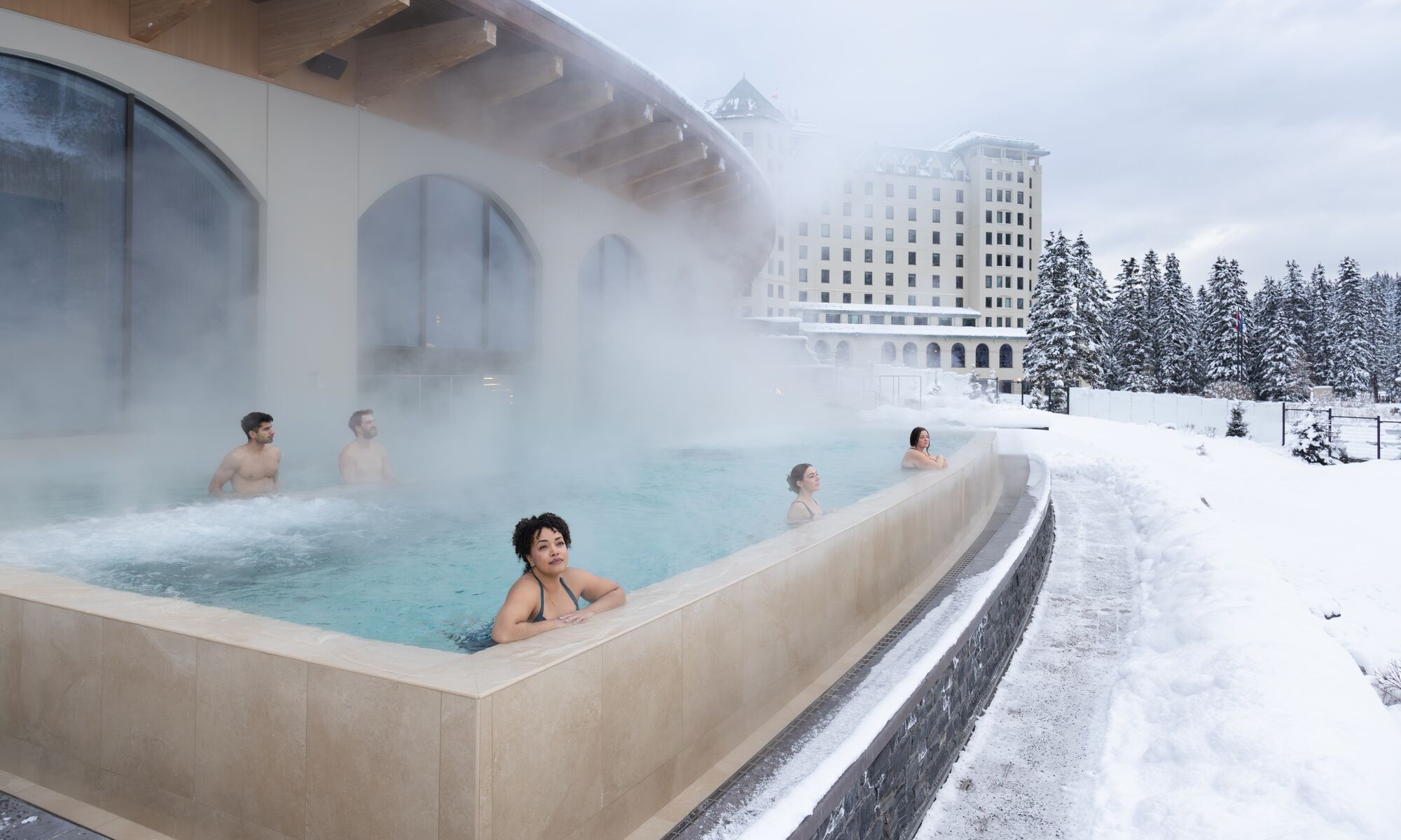 People in an outdoor swimming pool in Banff National Park