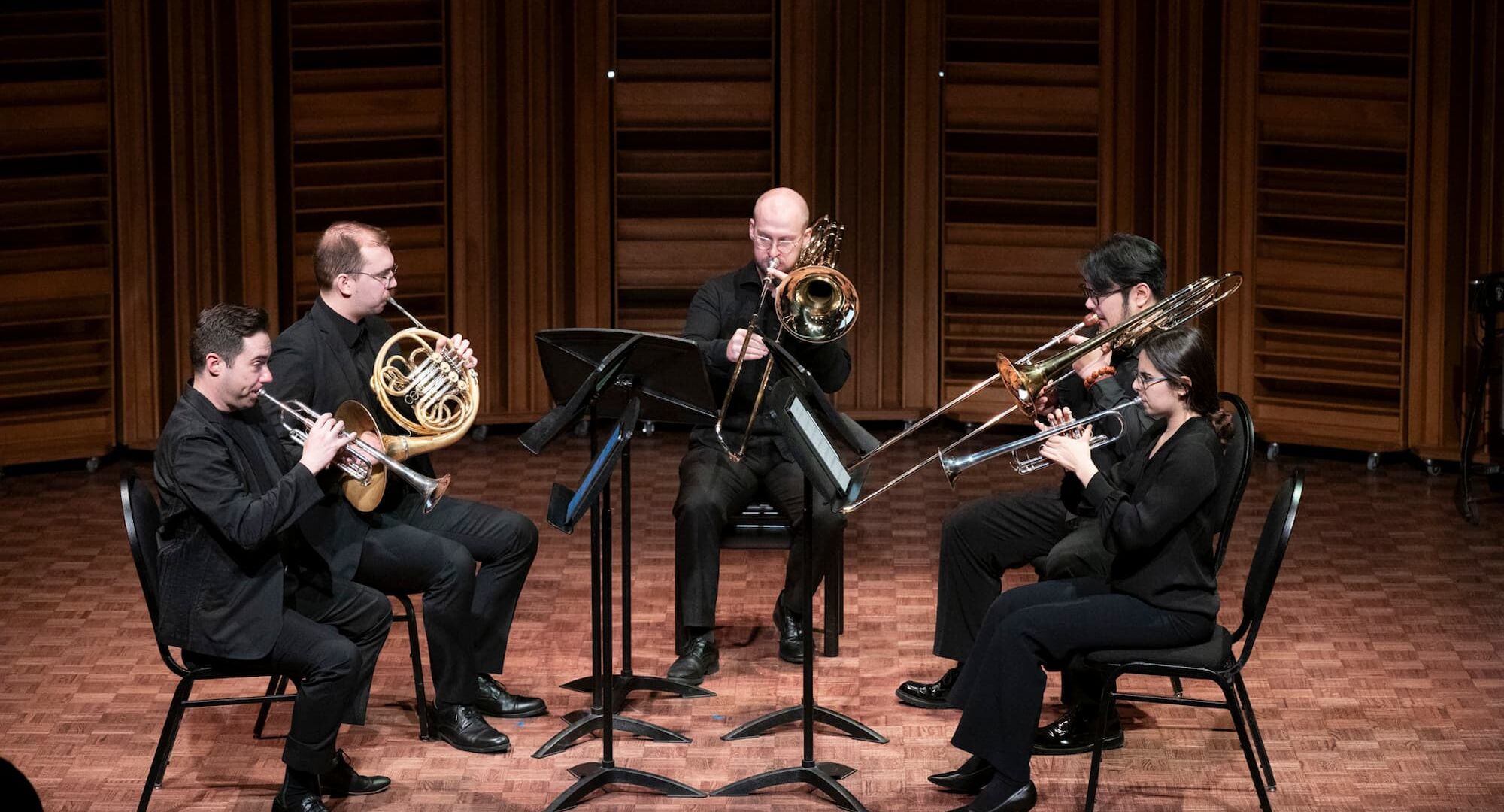 nterplay Faculty and Participant Chamber Music Concert, 2025. L to R: Joel Brennan (trumpet), Tyrell Loster Peitzsche (horn), DJ Combs (bass trombone), Charlie Cao (trombone), and Fiona Shonik (trumpet).