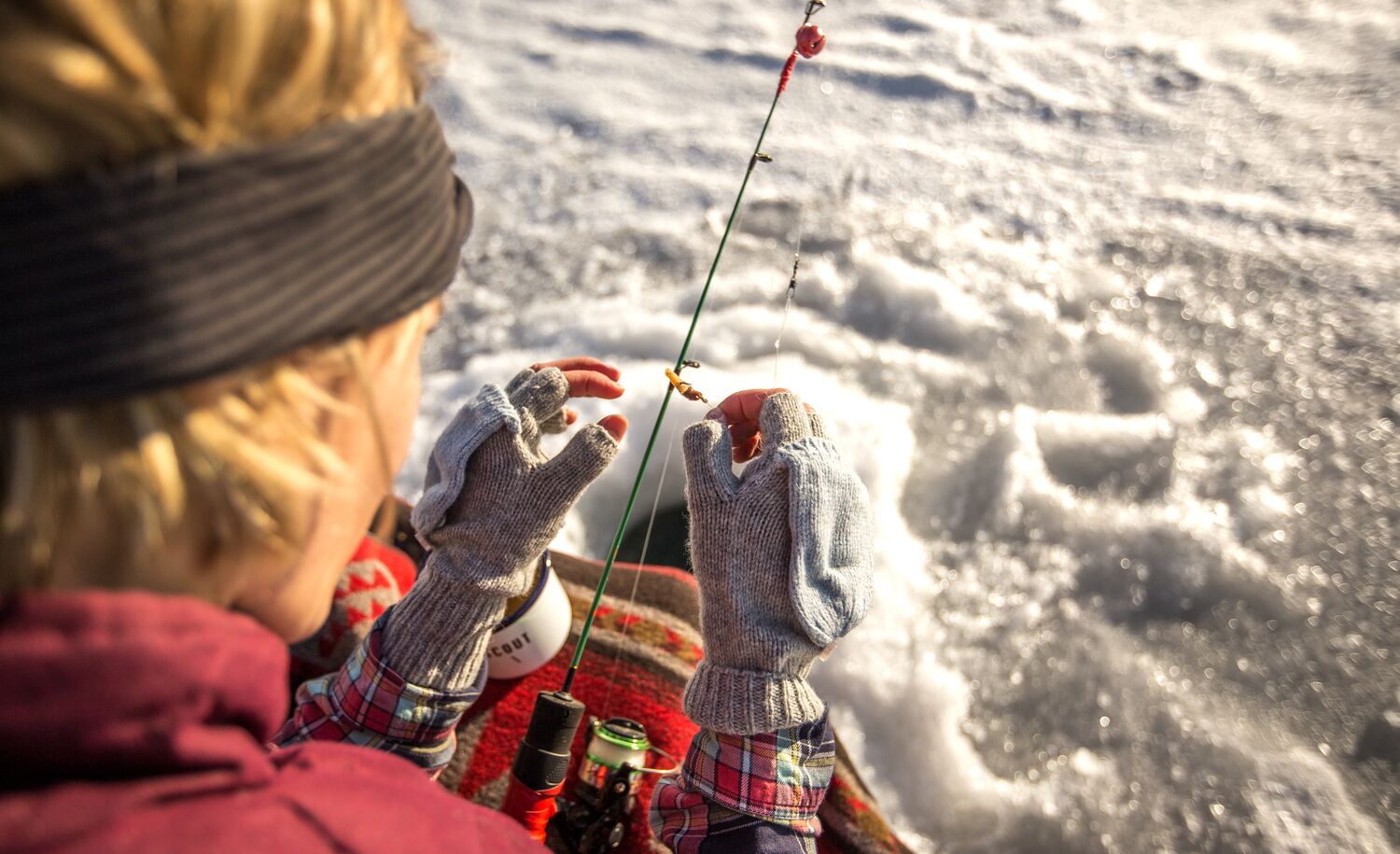 A person ice fishing in Banff National Park