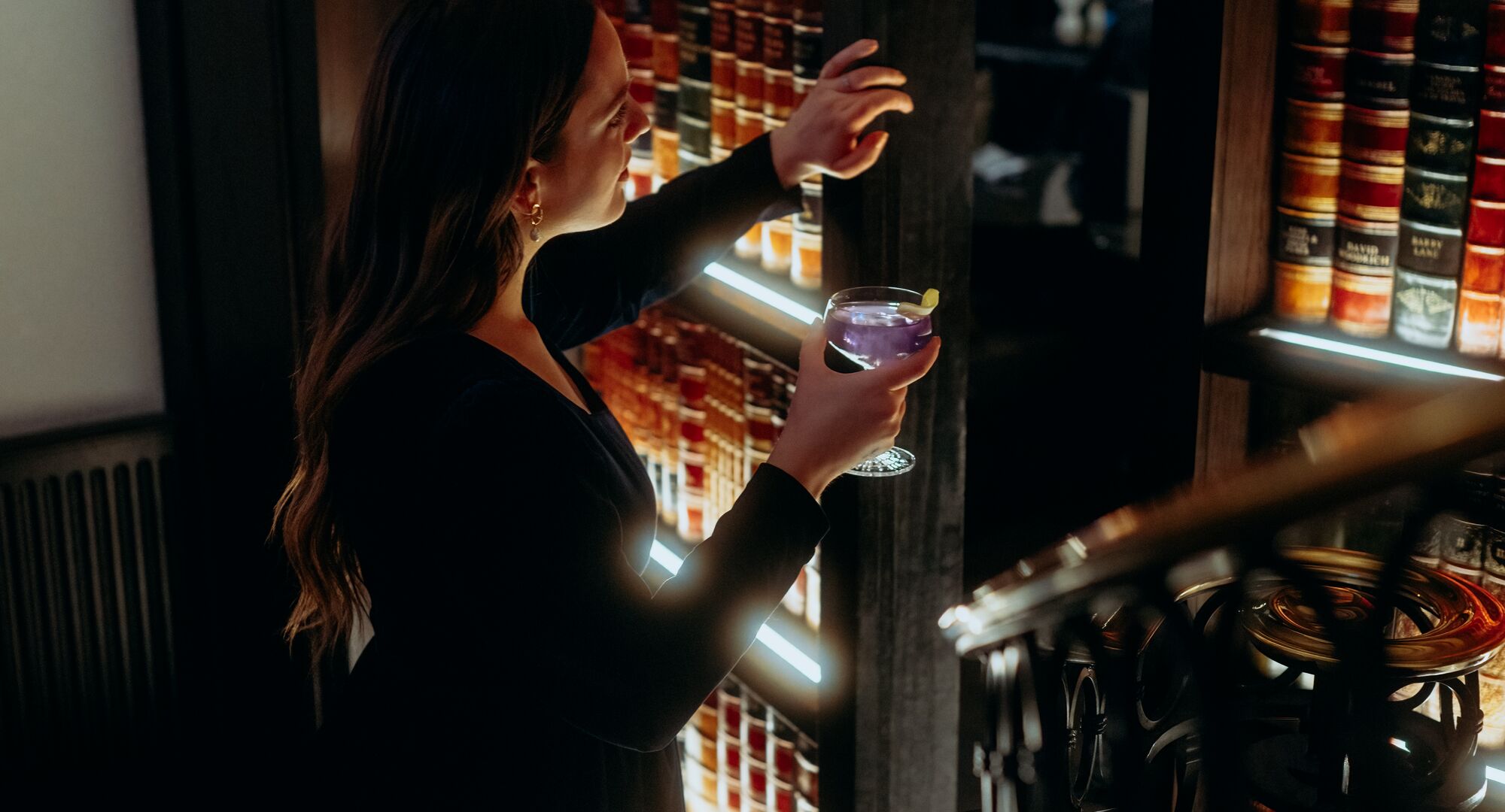 Woman opening up Side Car door inside Rundle Bar