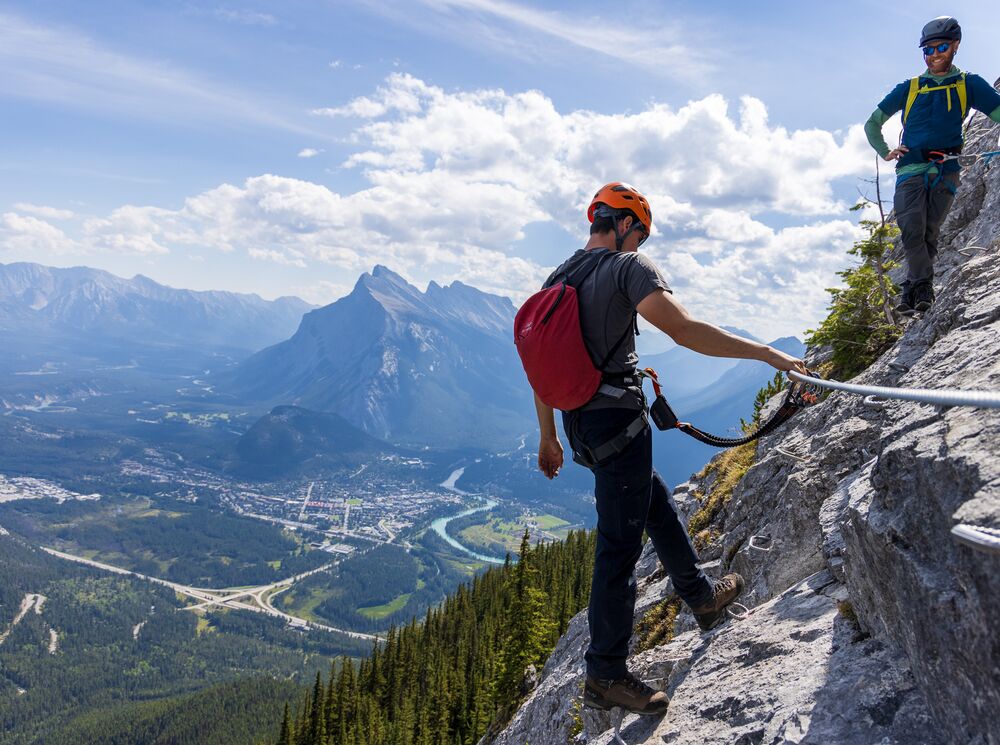 Two people on the Via Ferrata at Mount Norquay, a popular thing to do in Banff in July