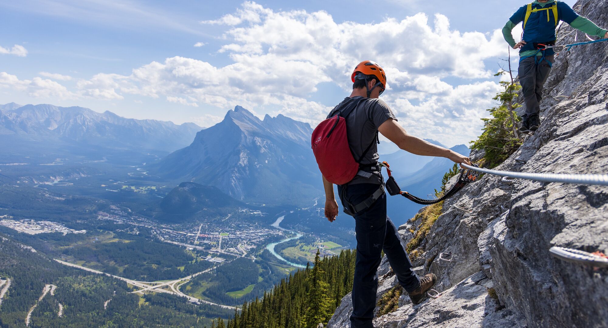 Person on the Via Ferrata overlooking Mount Rundle
