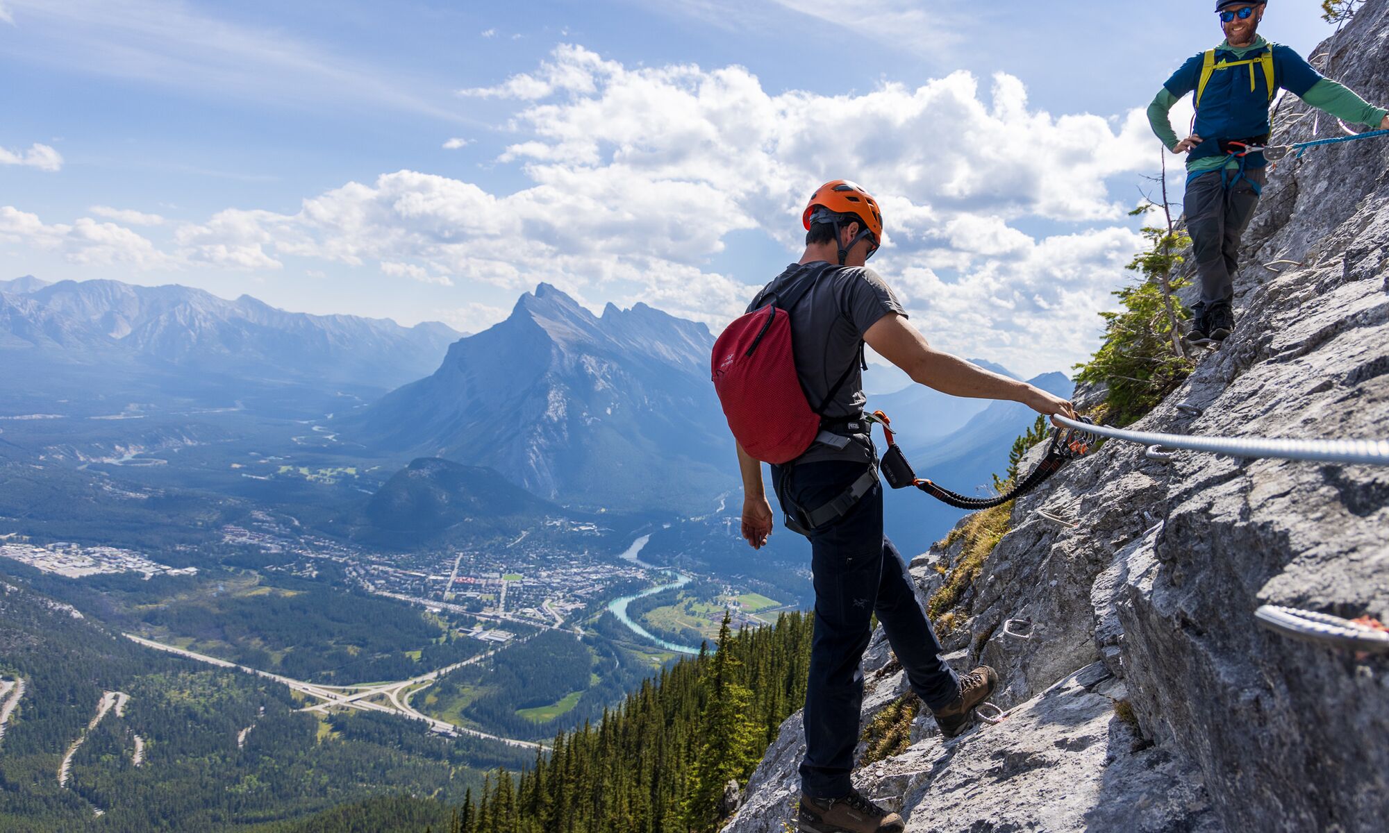 Two people on the Via Ferrata at Mount Norquay, a popular thing to do in Banff in July