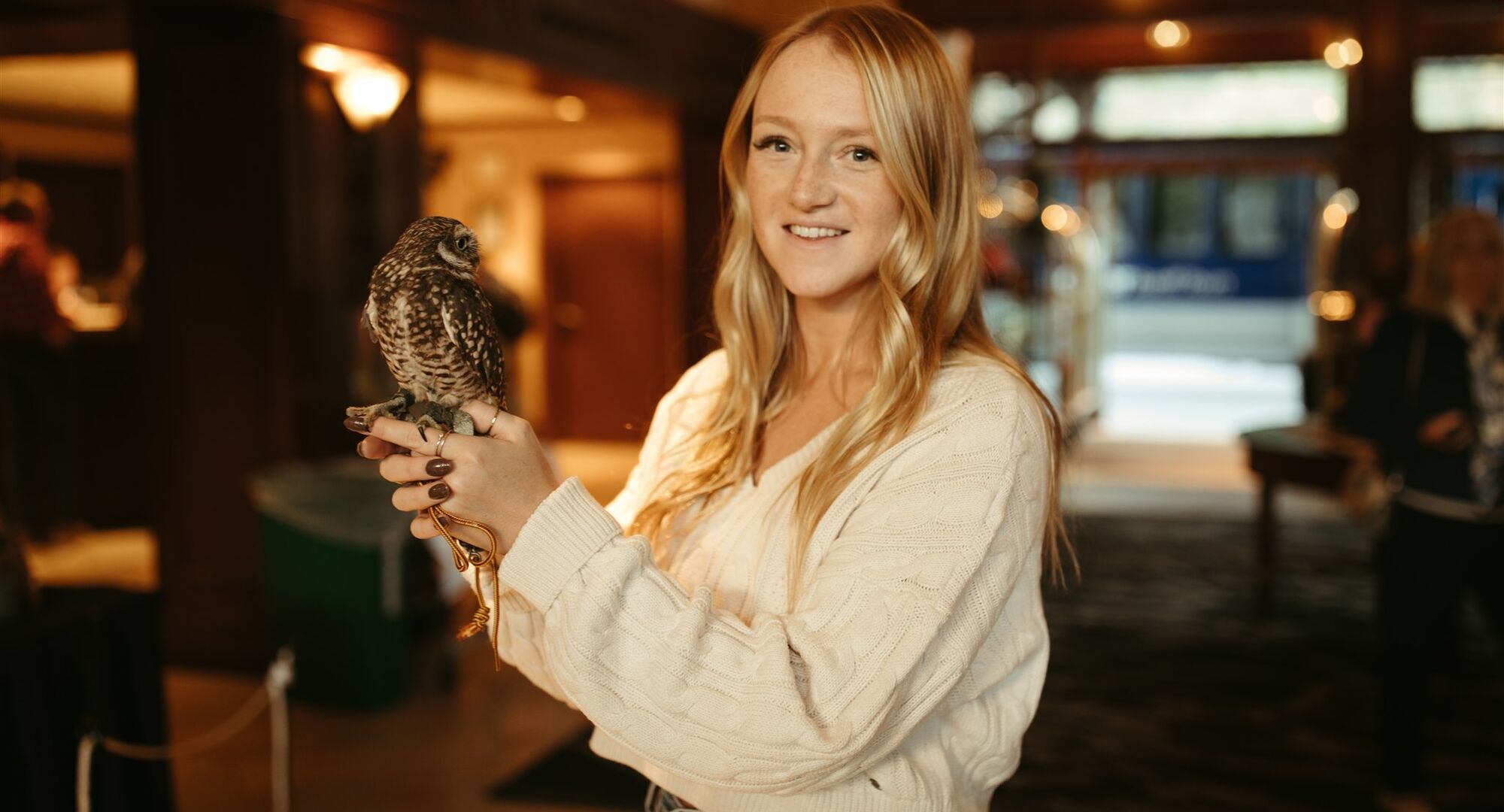 woman holding owl