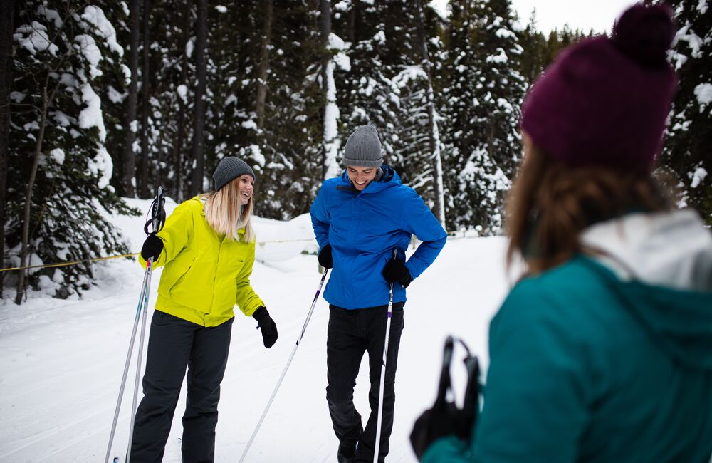 Group of friends cross-country skiing Spray Loop in Banff National Park