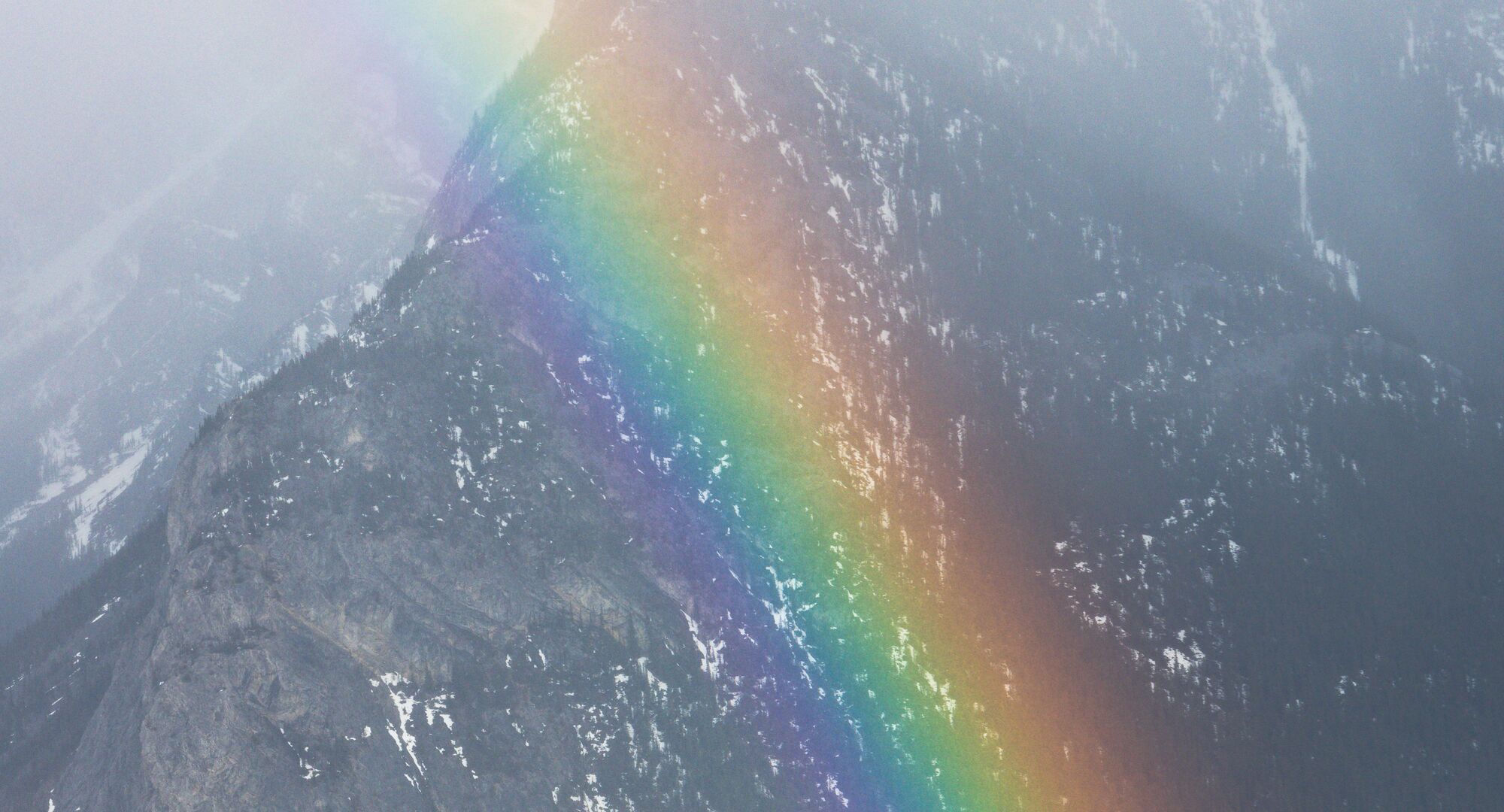 A rainbow in front of Mount Rundle in Banff National Park.