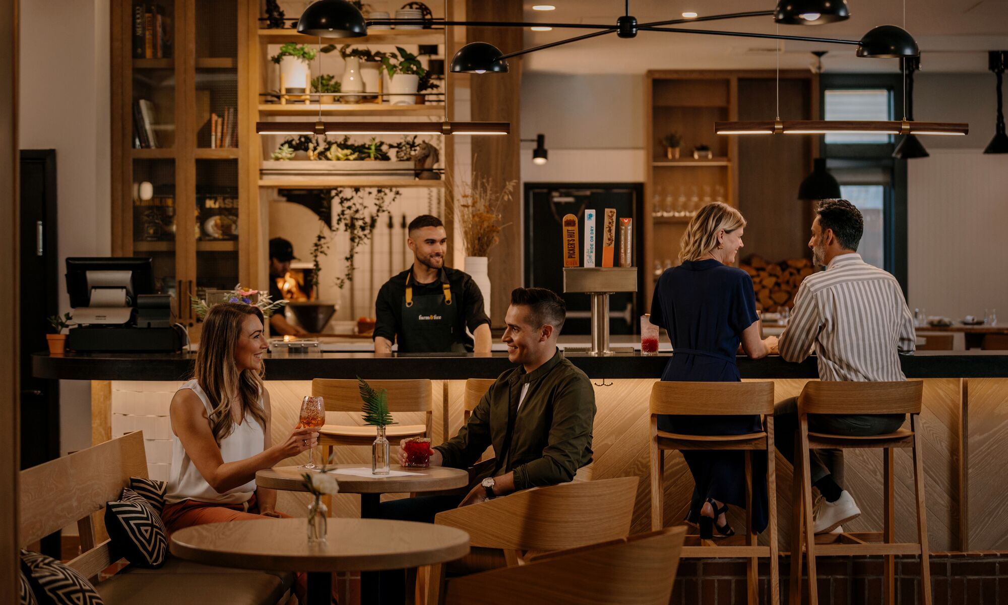 People dine at Farm & Fire in Banff National Park.