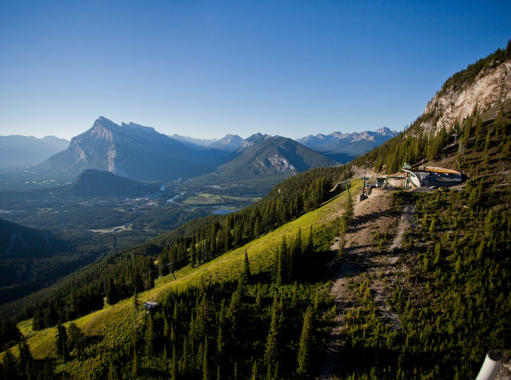 Aerial shot of Cliffhouse Bistro on Mt. Norquay in Banff National Park with Mt. Rundle in the background.