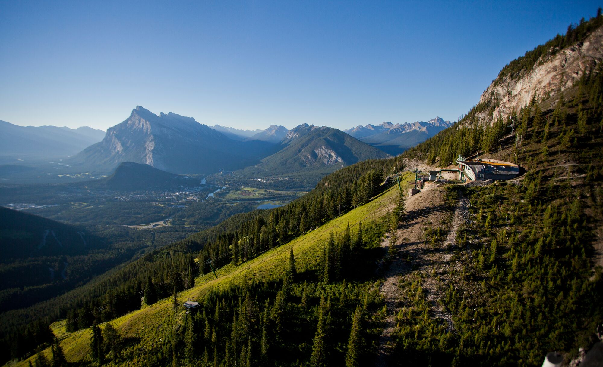 Aerial shot of Cliffhouse Bistro on Mt. Norquay in Banff National Park with Mt. Rundle in the background.