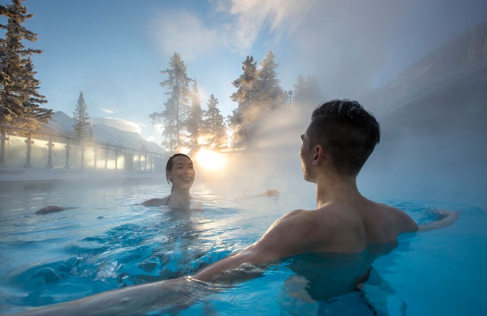 A couple enjoying the warmth of Banff Upper Hot Springs