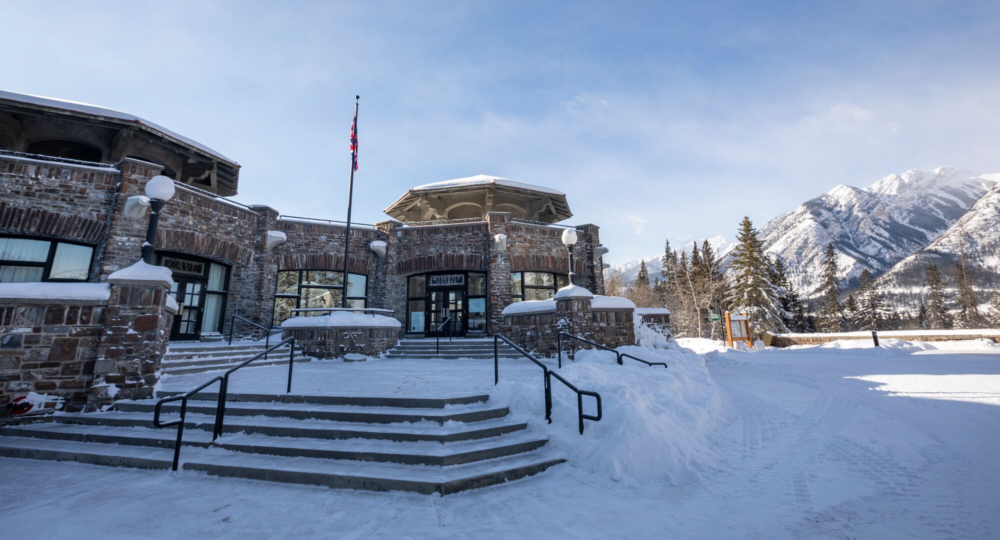 The Cave & Basin National Historic site covered in snow on a sunny winter day