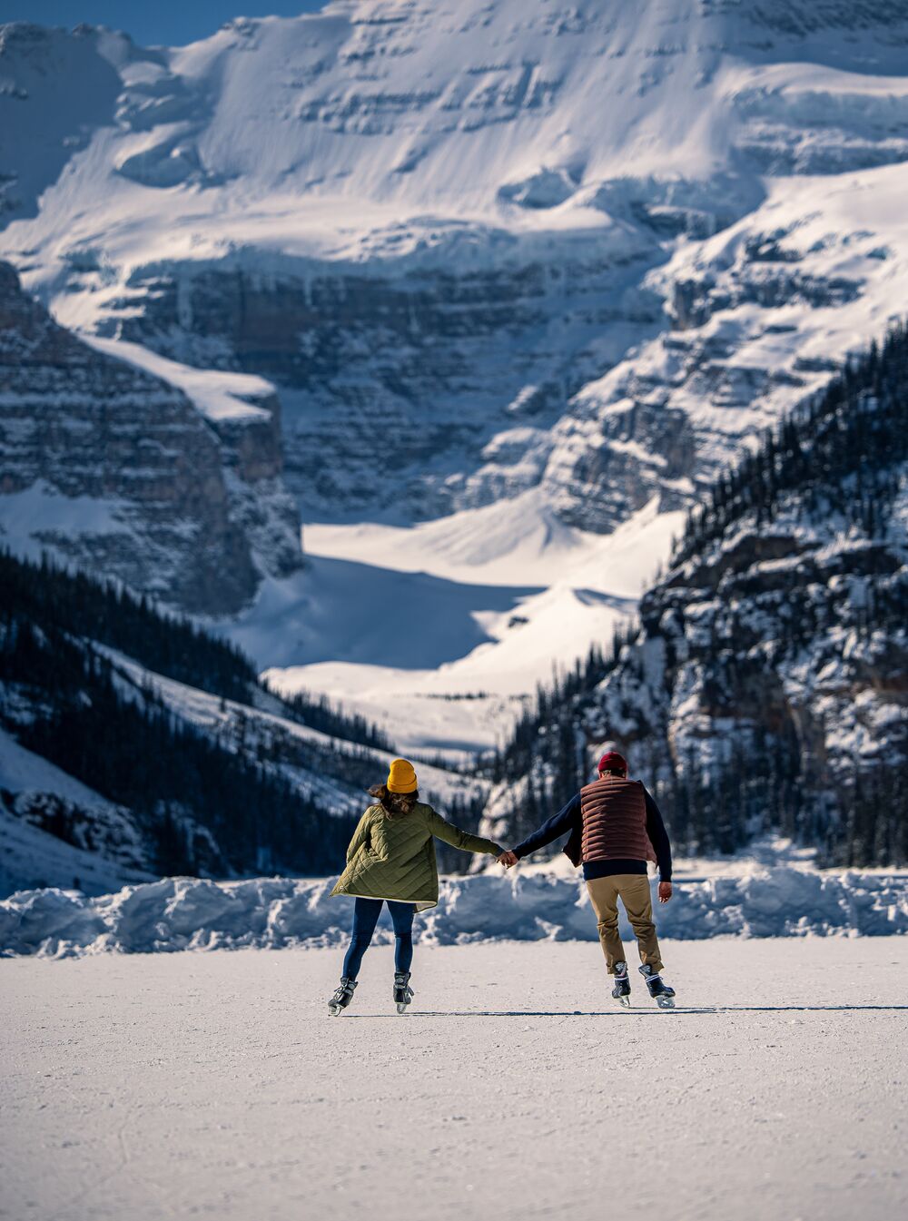 A couple skates on the rink at Lake Louise in Banff National Park.