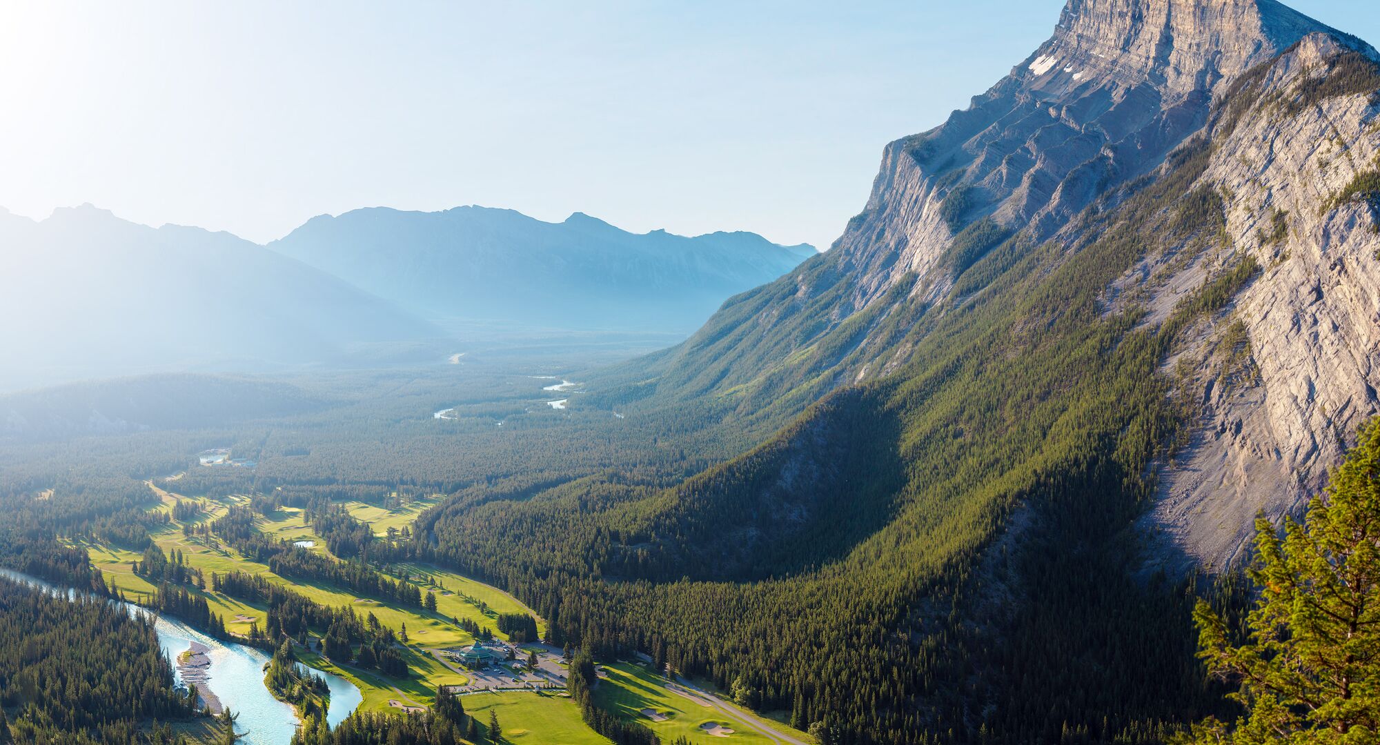 Mountains, trees and river along the Fairmont Banff Springs Golf Course.