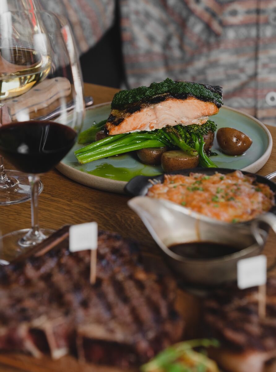 Steak and fixings sit on a table at Chuck's Steakhouse in Banff.