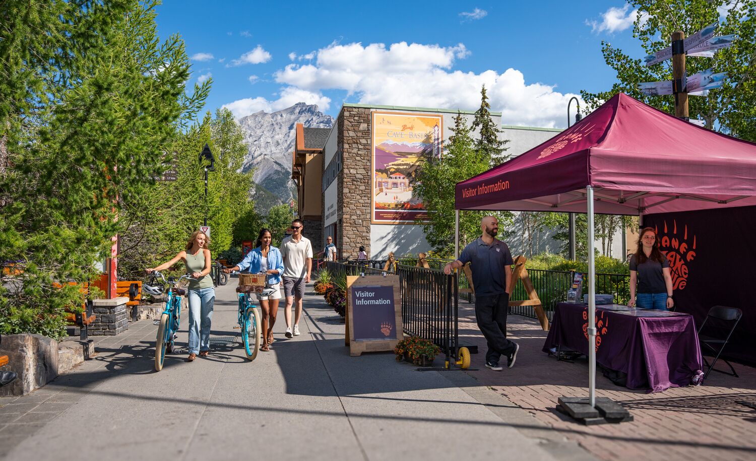 People using the bike parking on Banff Ave, a popular thing to do in Banff in June
