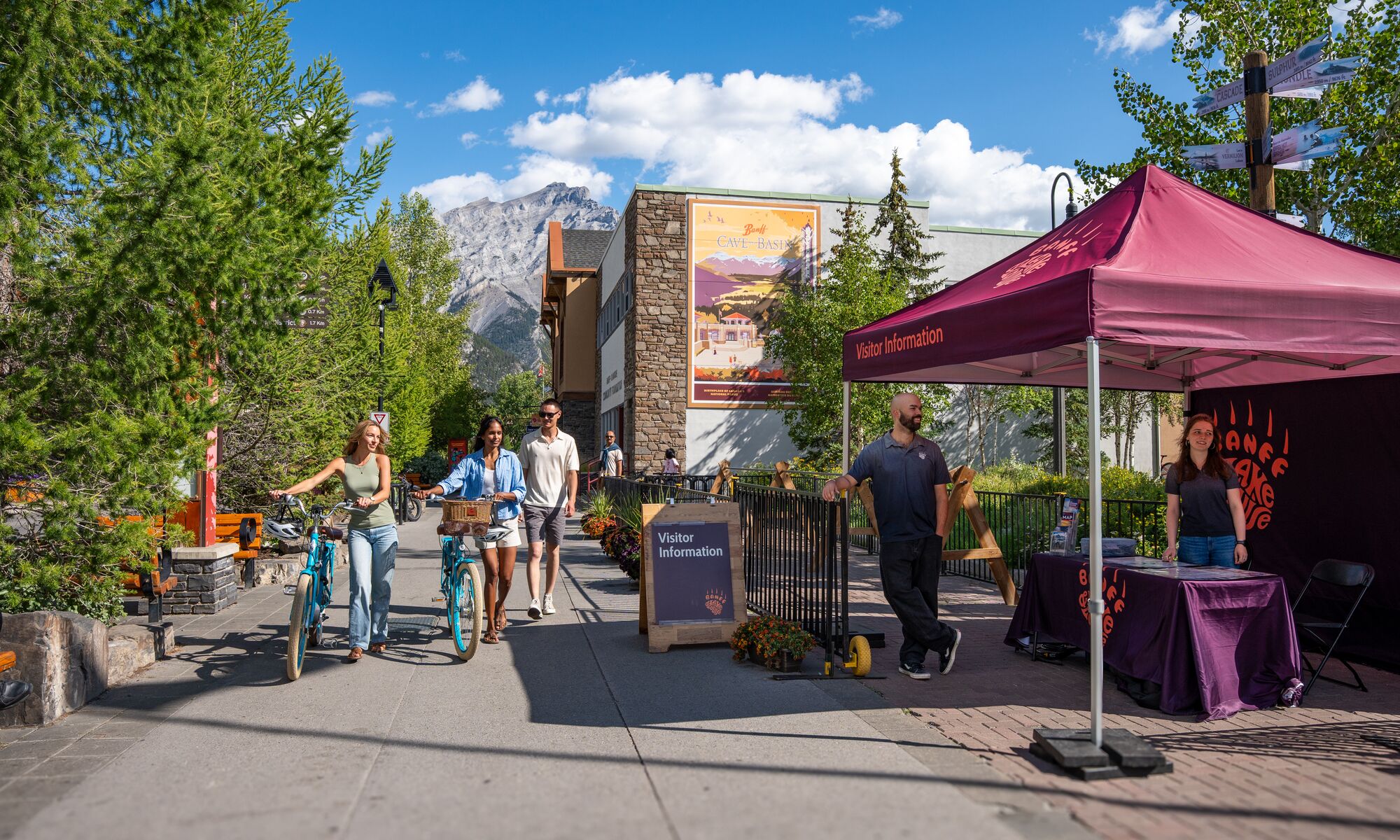 People using the bike parking on Banff Ave, a popular thing to do in Banff in June