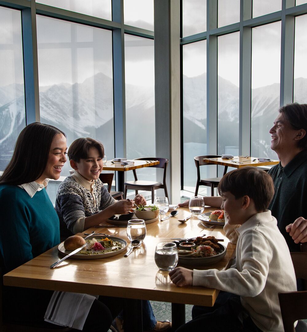 A family enjoying a meal at the Sky Bistro at the top of the Banff Gondola