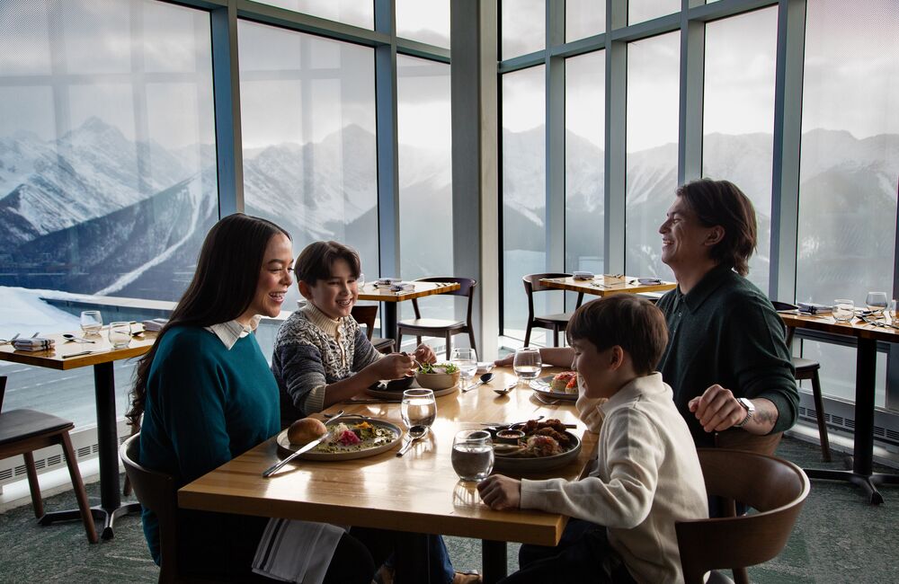 A family enjoying a meal at the Sky Bistro at the top of the Banff Gondola
