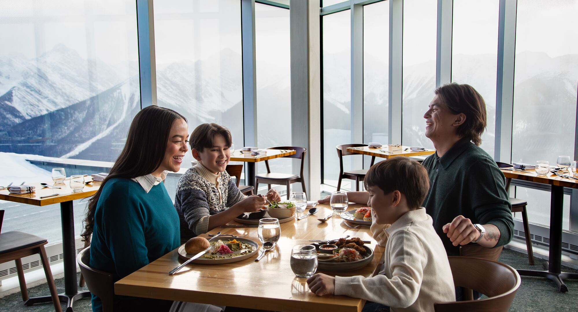 A family enjoying a meal at the Sky Bistro at the top of the Banff Gondola