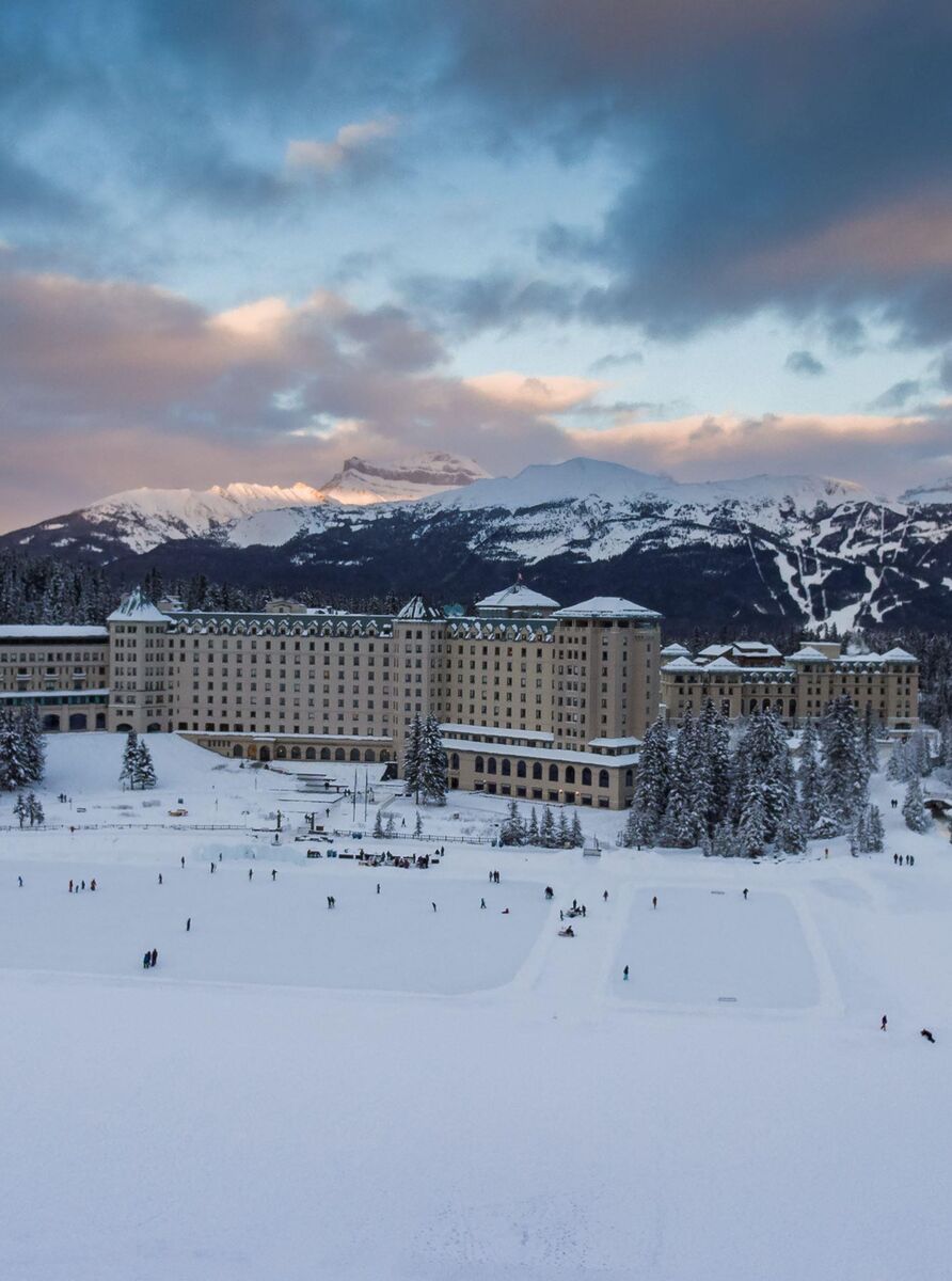 The Fairmont Chateau Lake Louise and its outdoor ice rink in the winter.