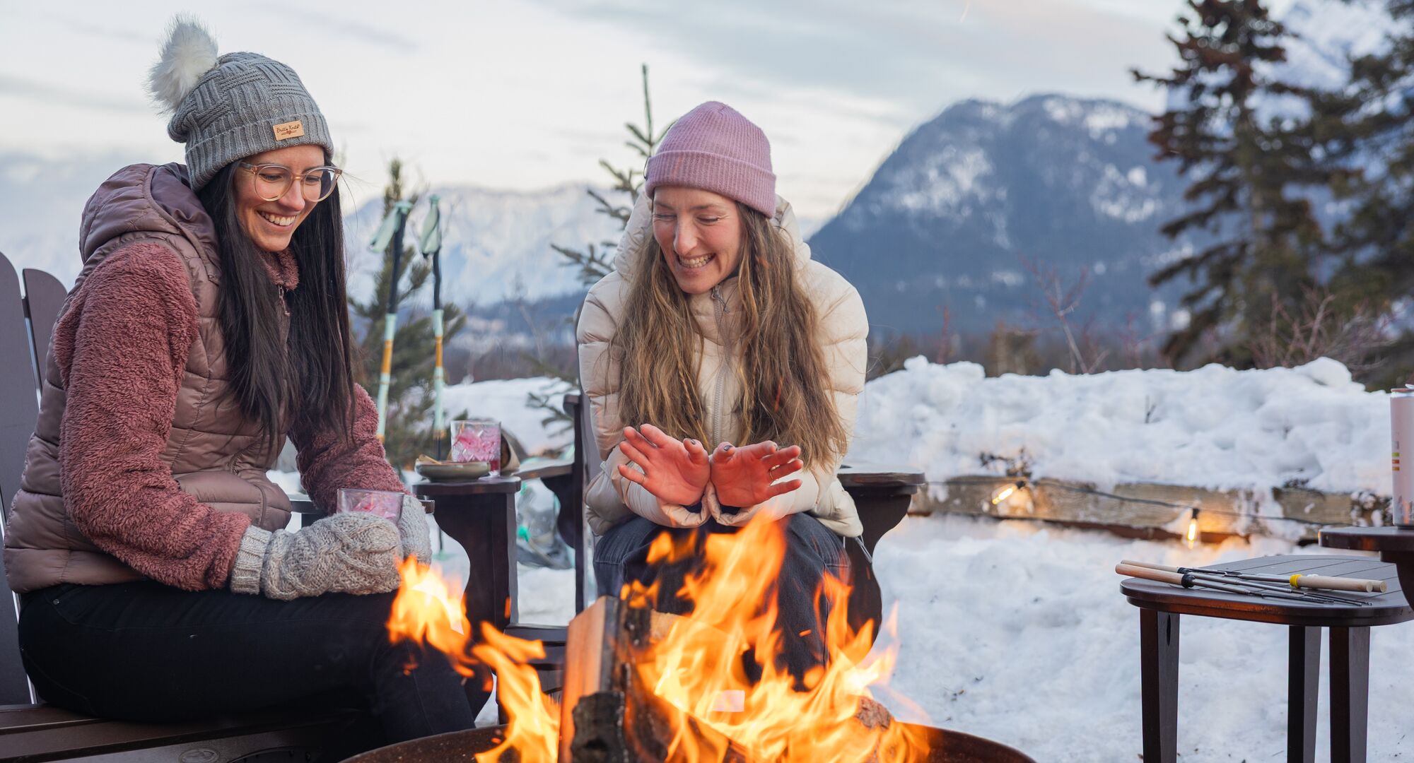 Two guests enjoy Fireside Sunset at the Juniper