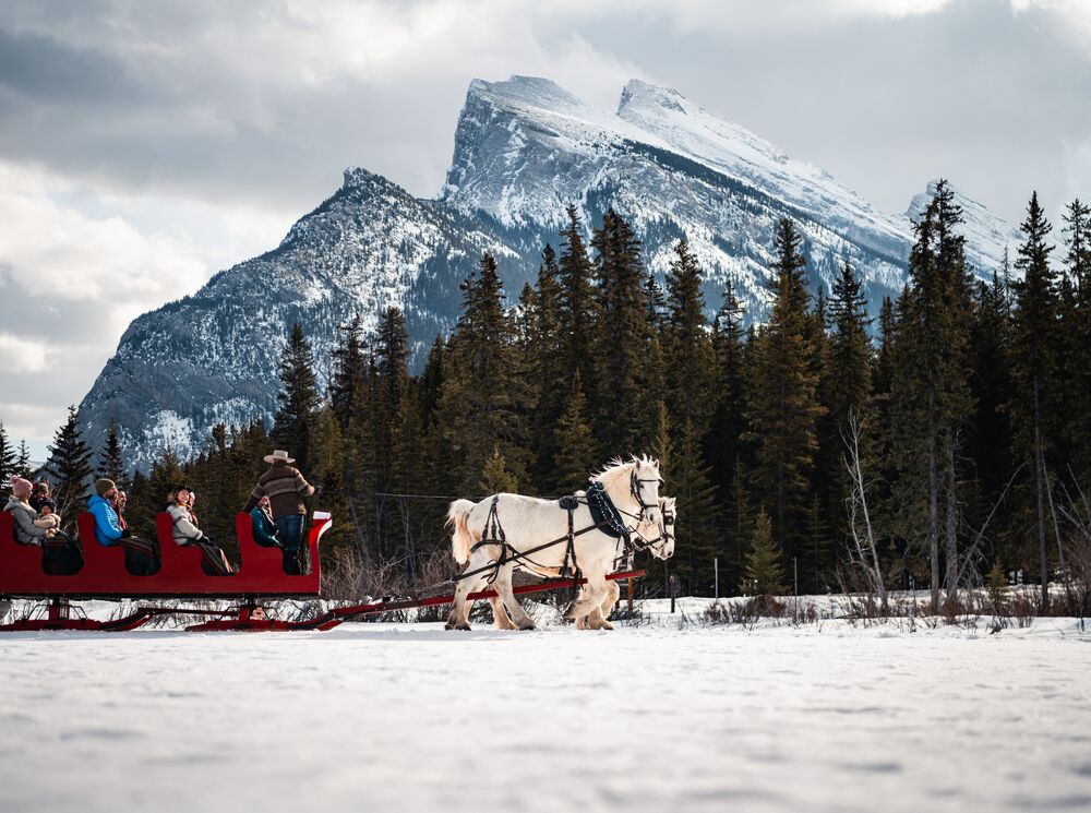 A sleigh ride underneath Mount Rundle in Banff National Park.