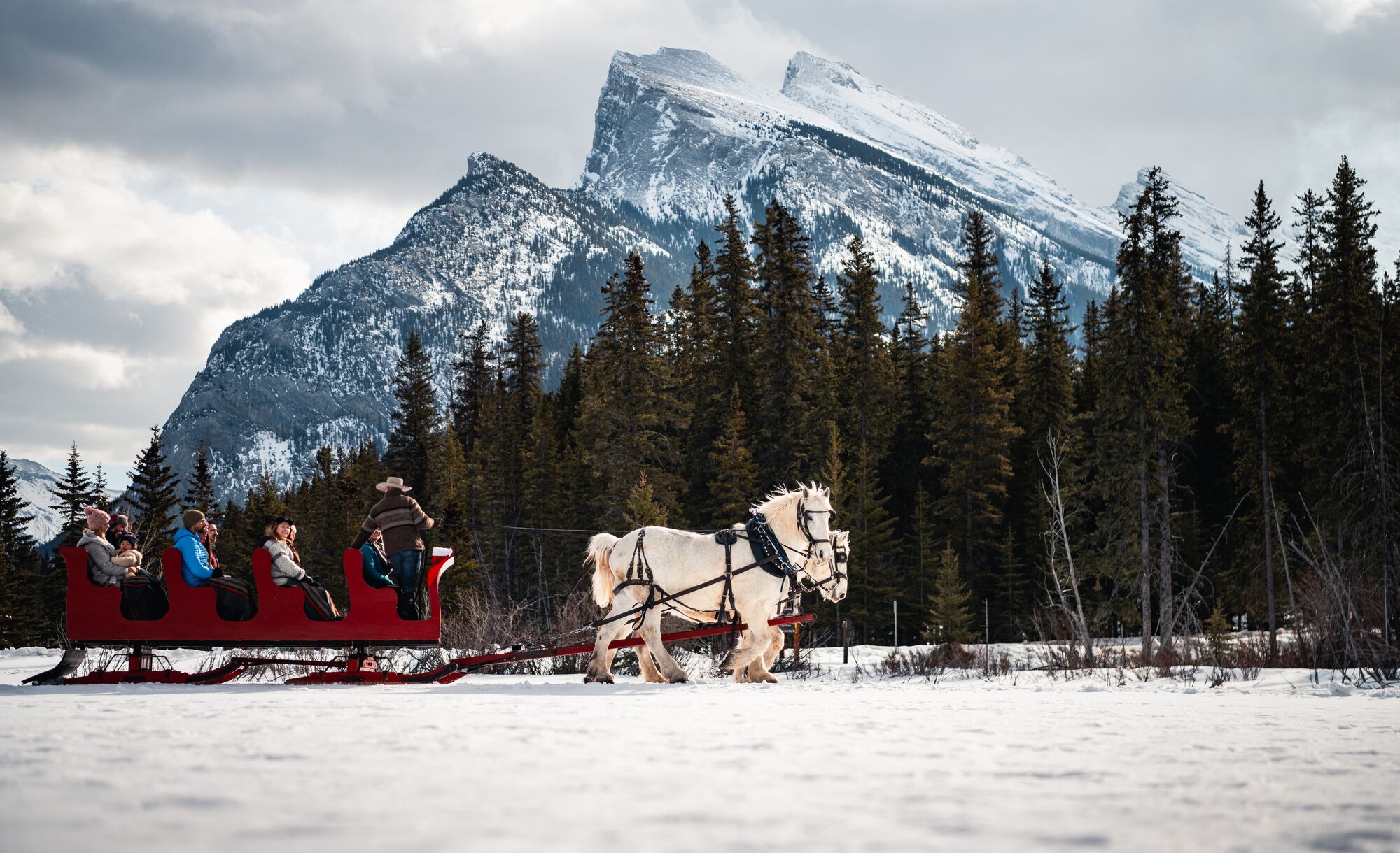 A sleigh ride underneath Mount Rundle in Banff National Park.