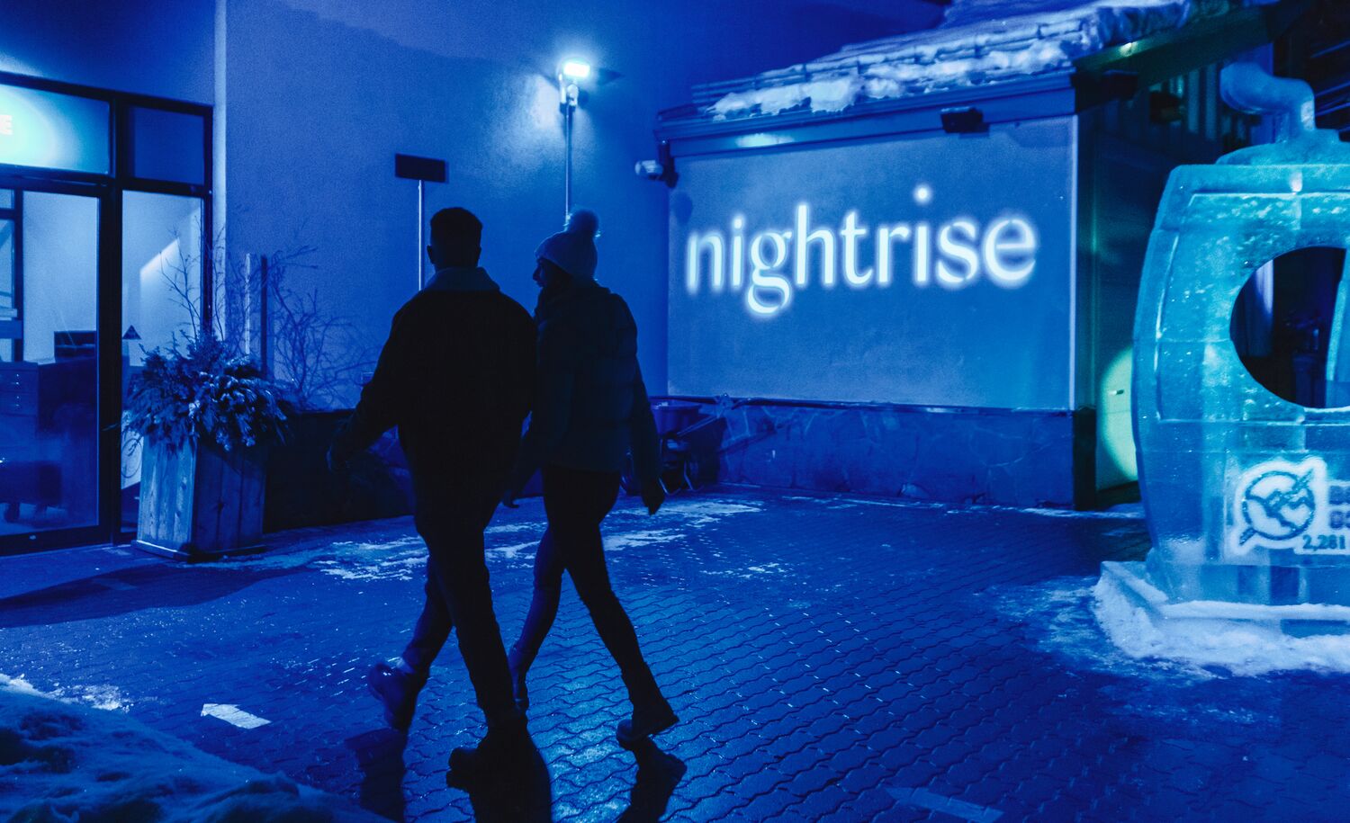A couple explores the Nightrise Event held at the Banff Gondola in Banff National Park