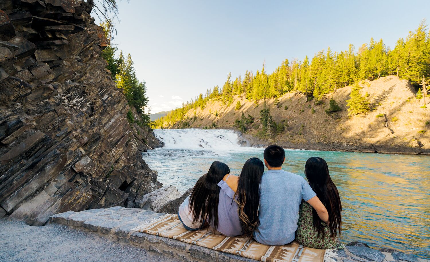 A family takes in Bow Falls in Banff National Park.