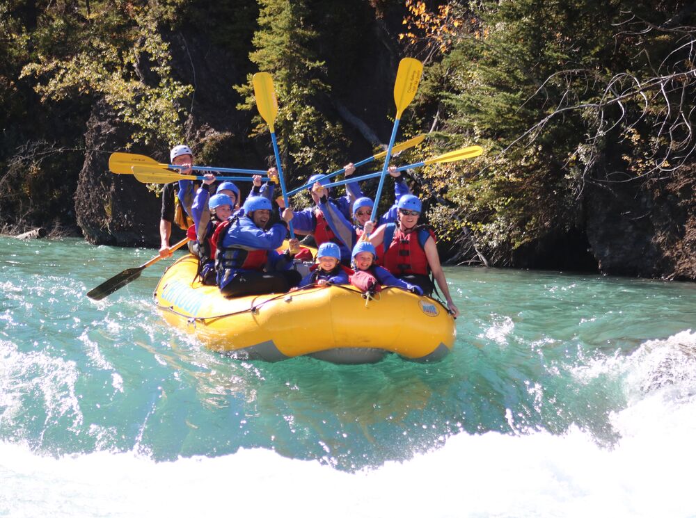 A group of people enjoying rafting, one of the most popular things to do in Banff National Park in June