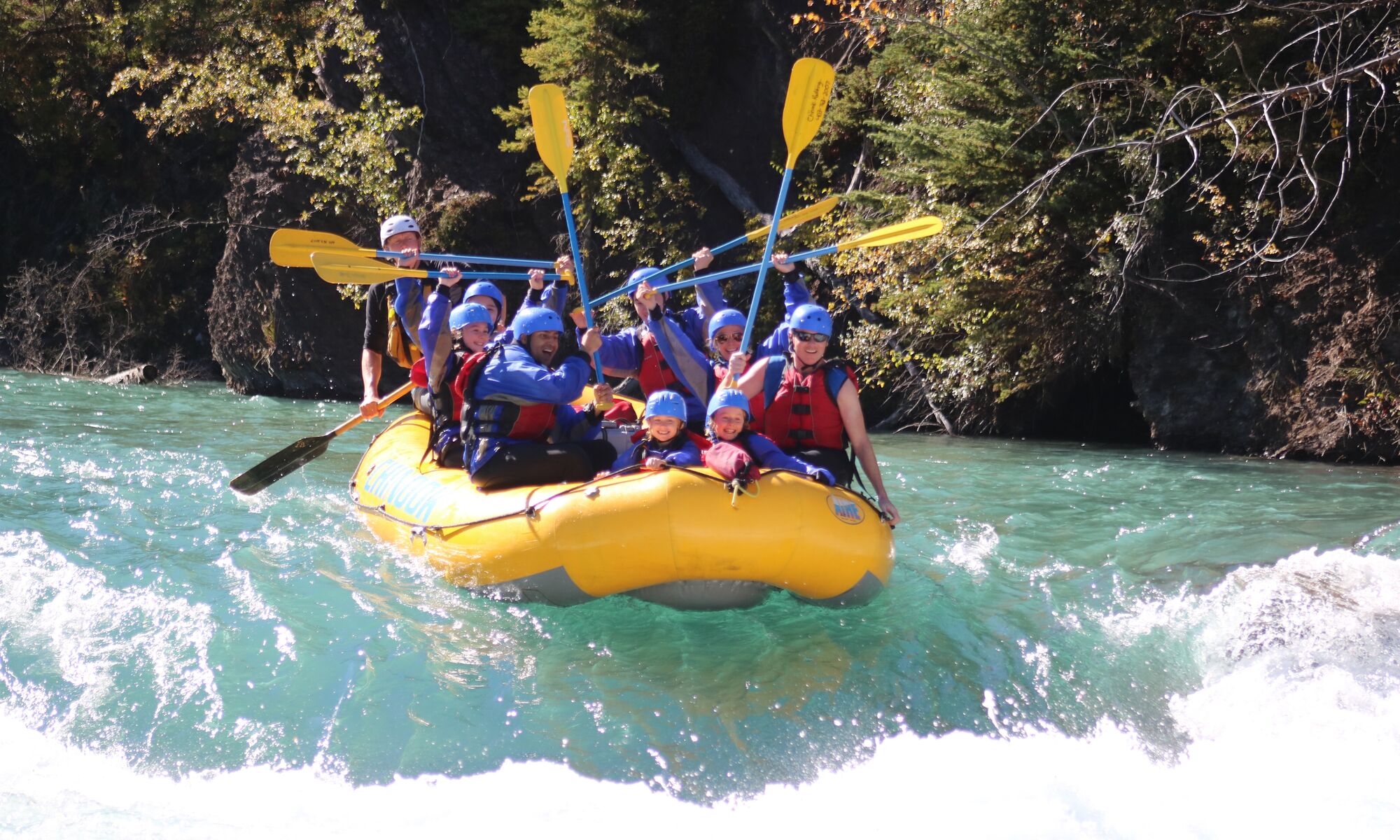 A group of people enjoying rafting, one of the most popular things to do in Banff National Park in June