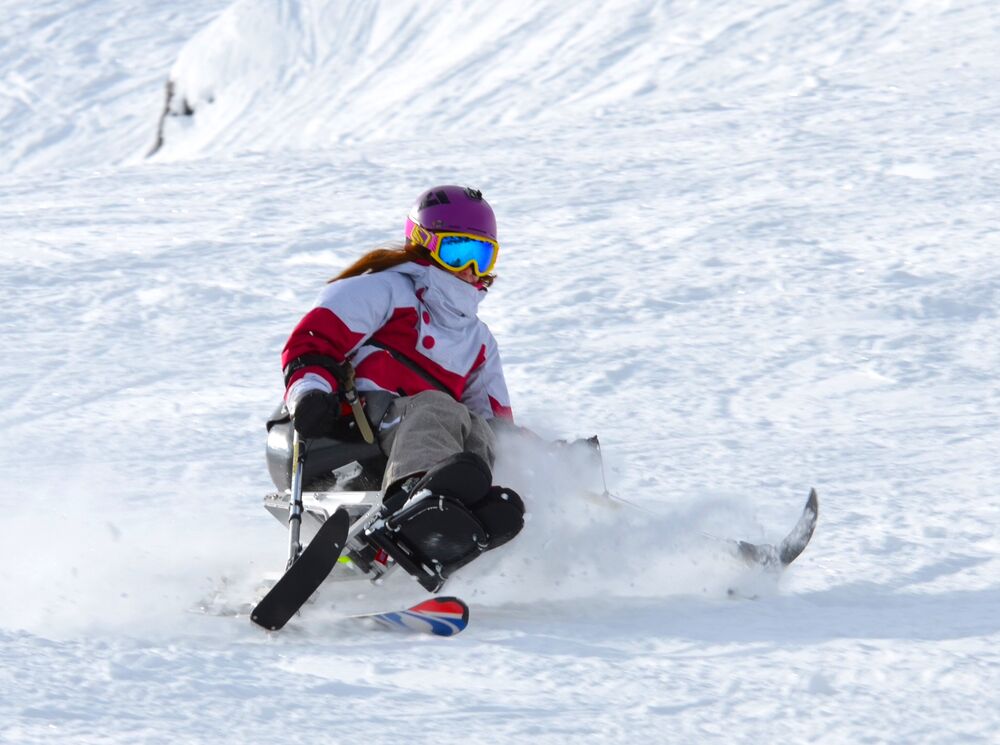 A person sit skiing at a ski resort in Banff National Park