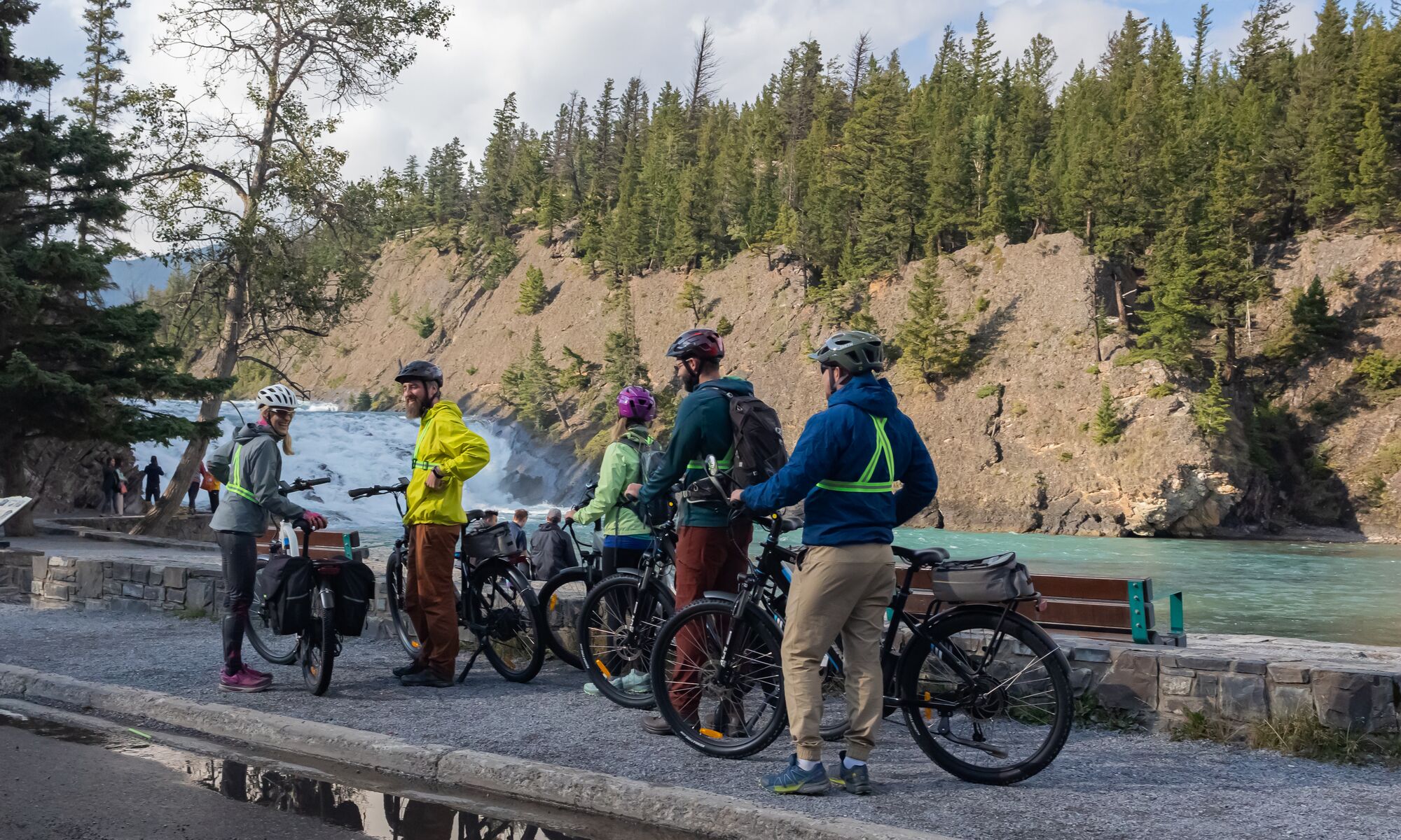 A group of cyclists at Bow Falls in Banff.