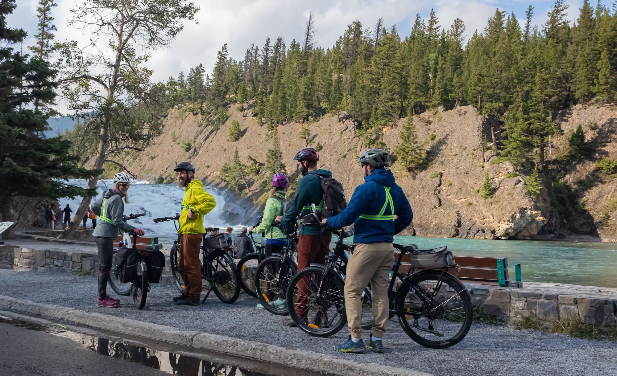 A group of cyclists at Bow Falls in Banff.