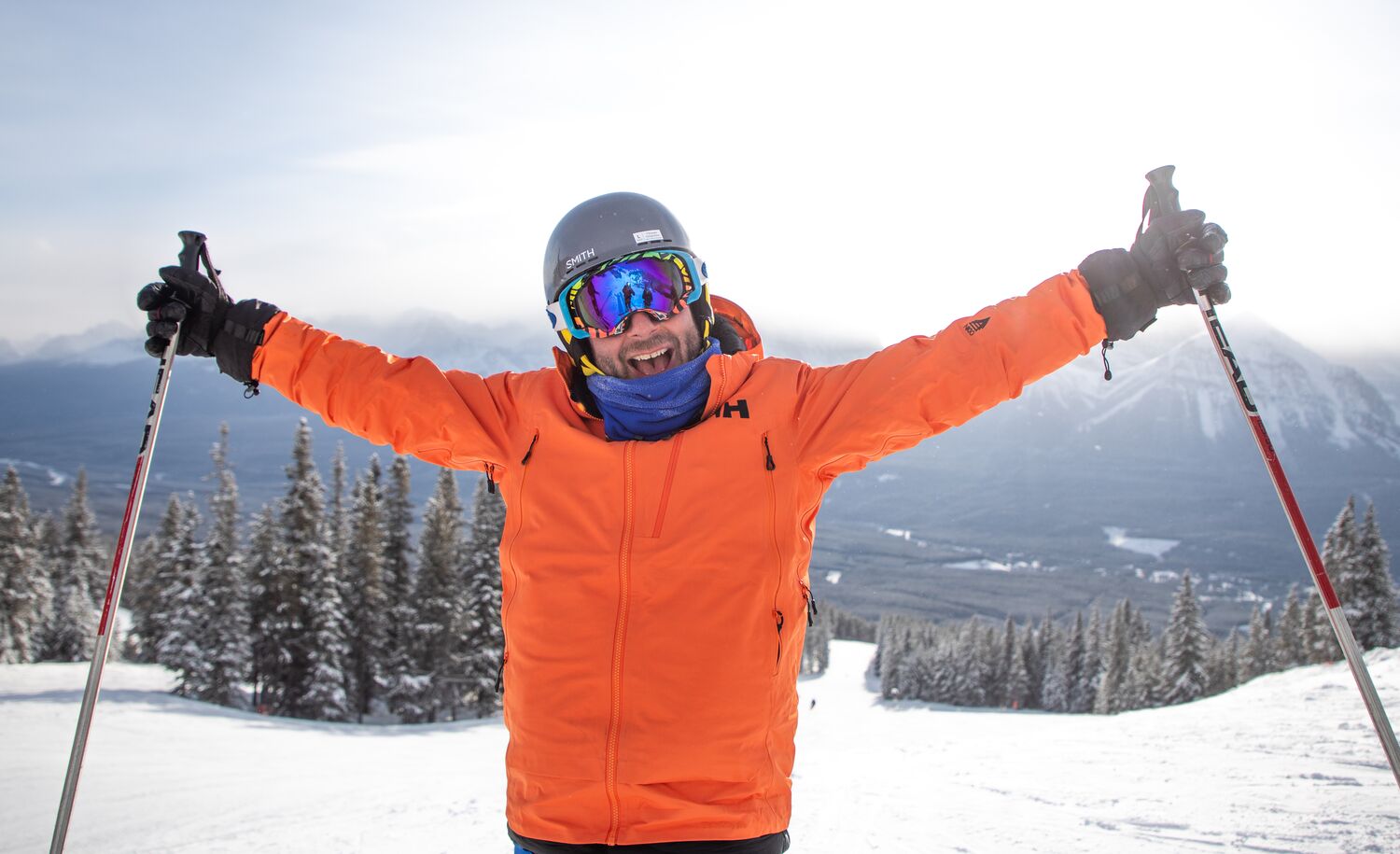A person looks at the camera in full ski gear at the Lake Louise Ski Resort.