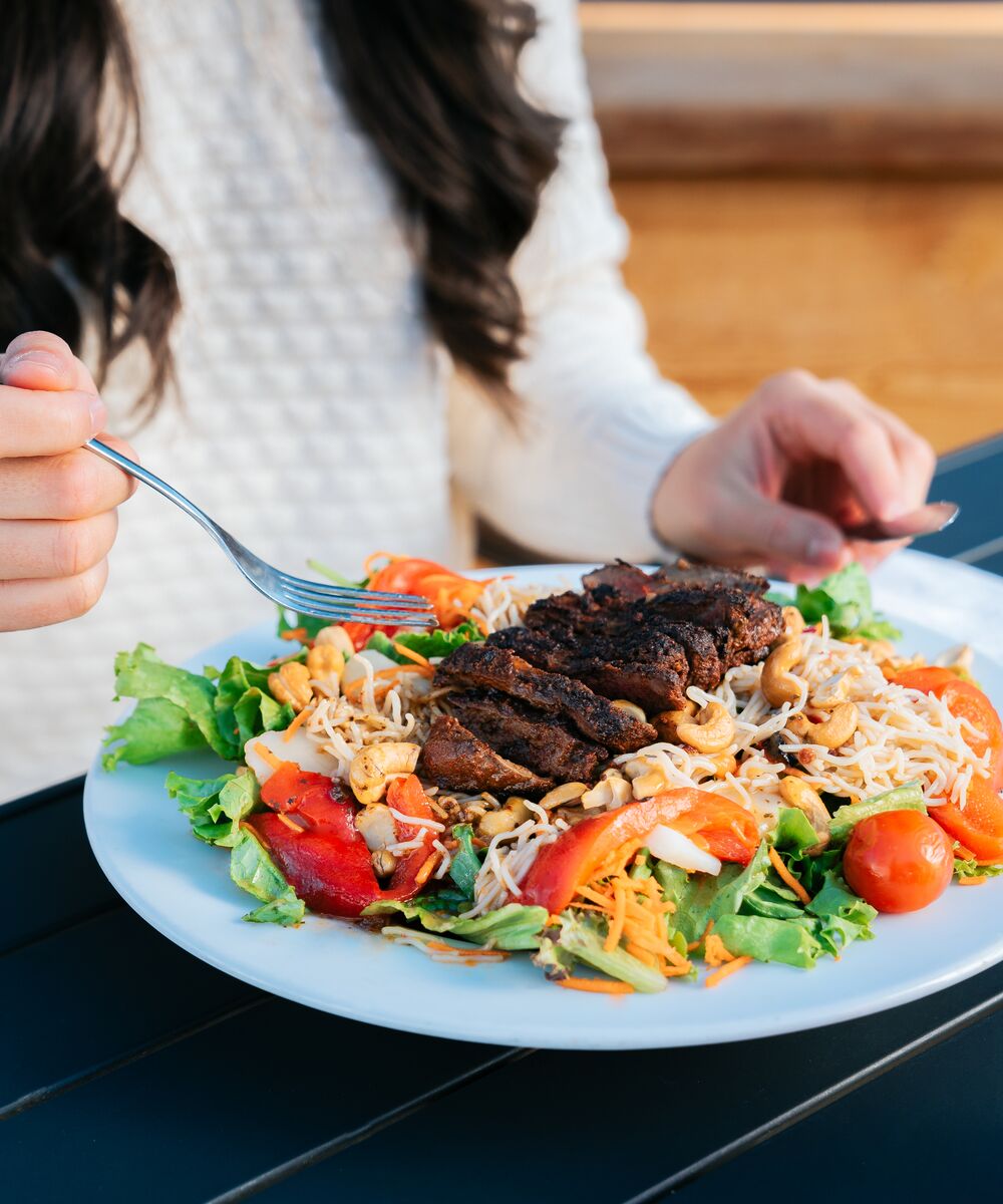 Close up photo of a salad on the Rose and Crown Patio in Banff