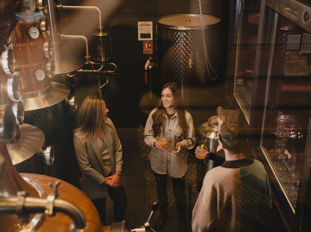 Four people take the PARK Distillery on-site tour in Banff.