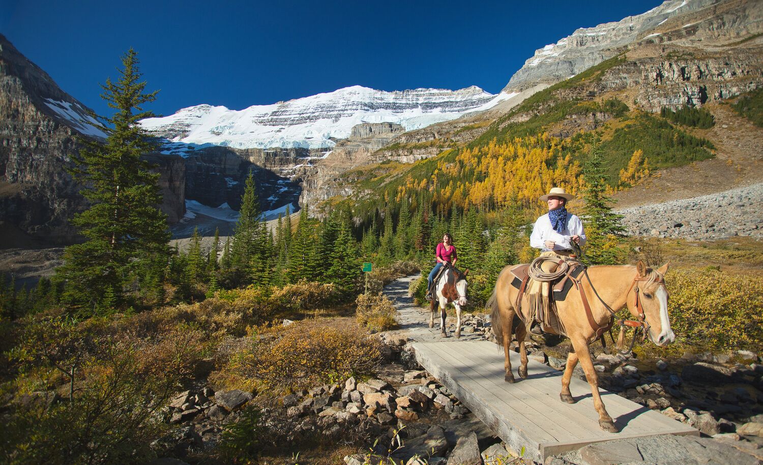 People on a guided horseback riding tour, a popular thing to do in Banff in September