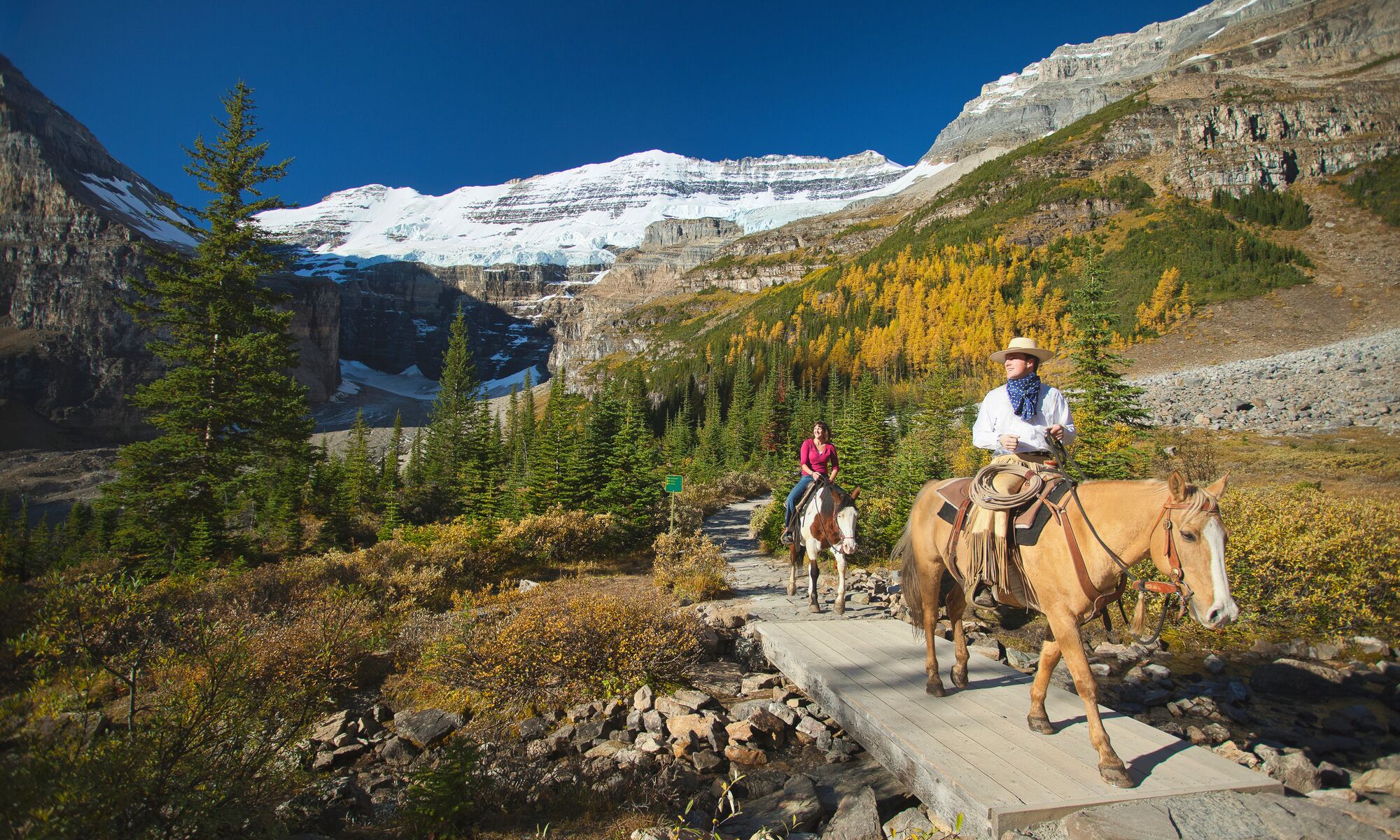 People on a guided horseback riding tour, a popular thing to do in Banff in September