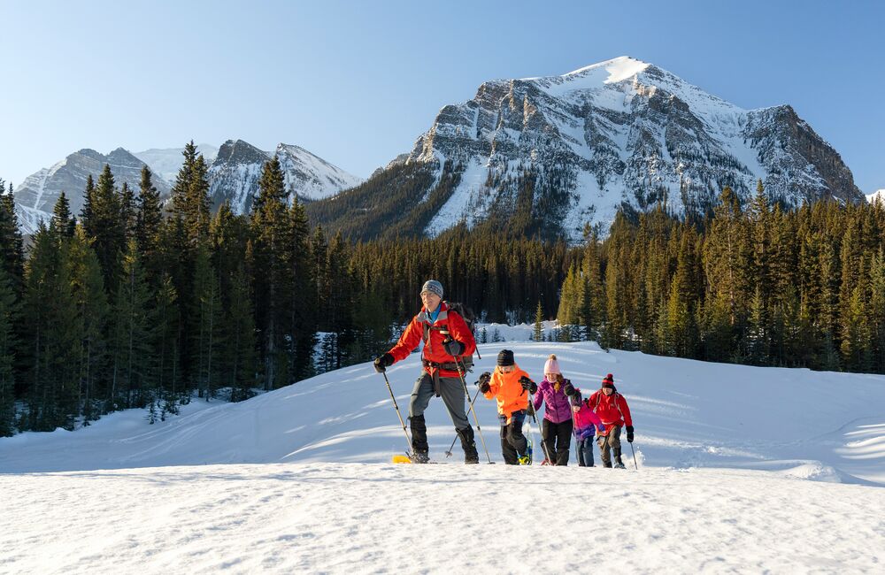 Group of people snowshoeing in the winter in Banff National Park
