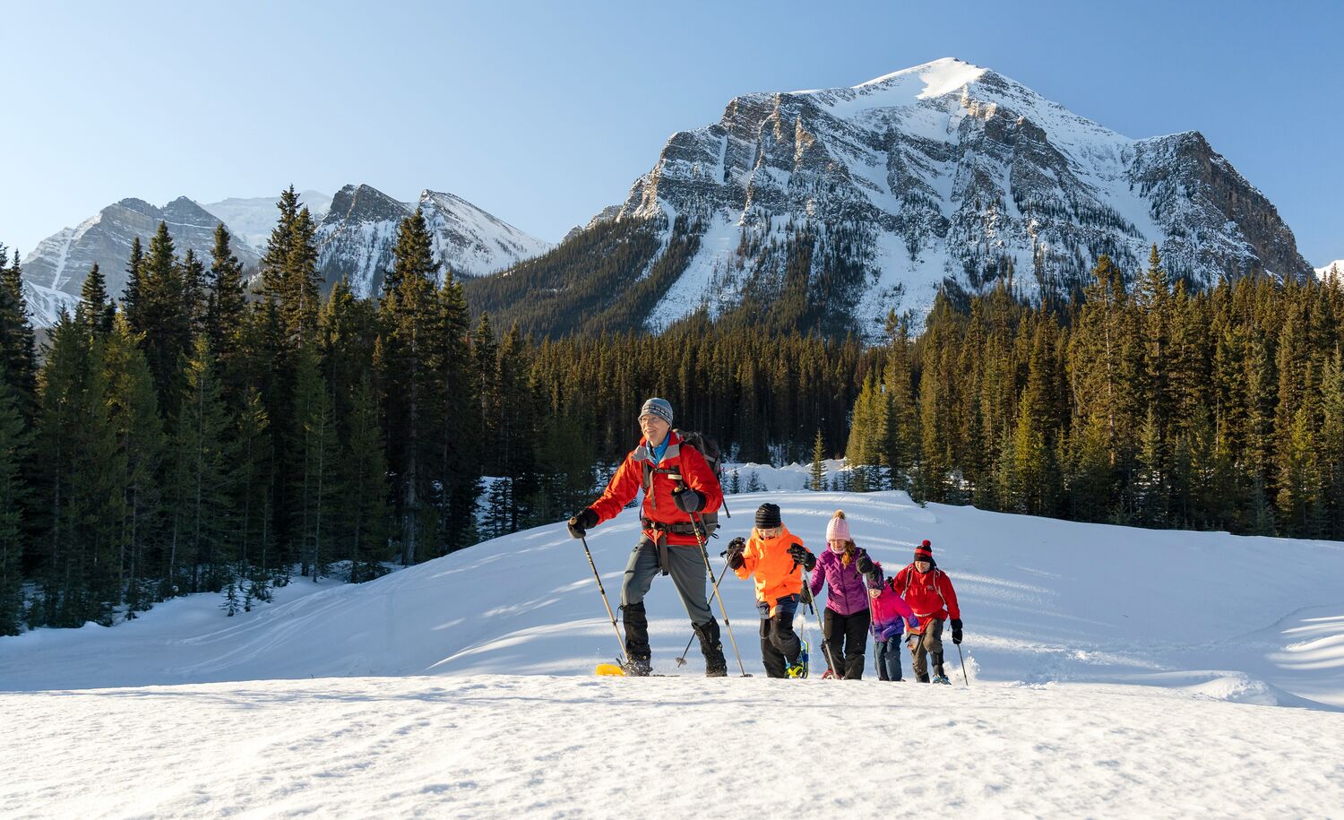 A group of snowshoers are out at the Great Divide Trail.