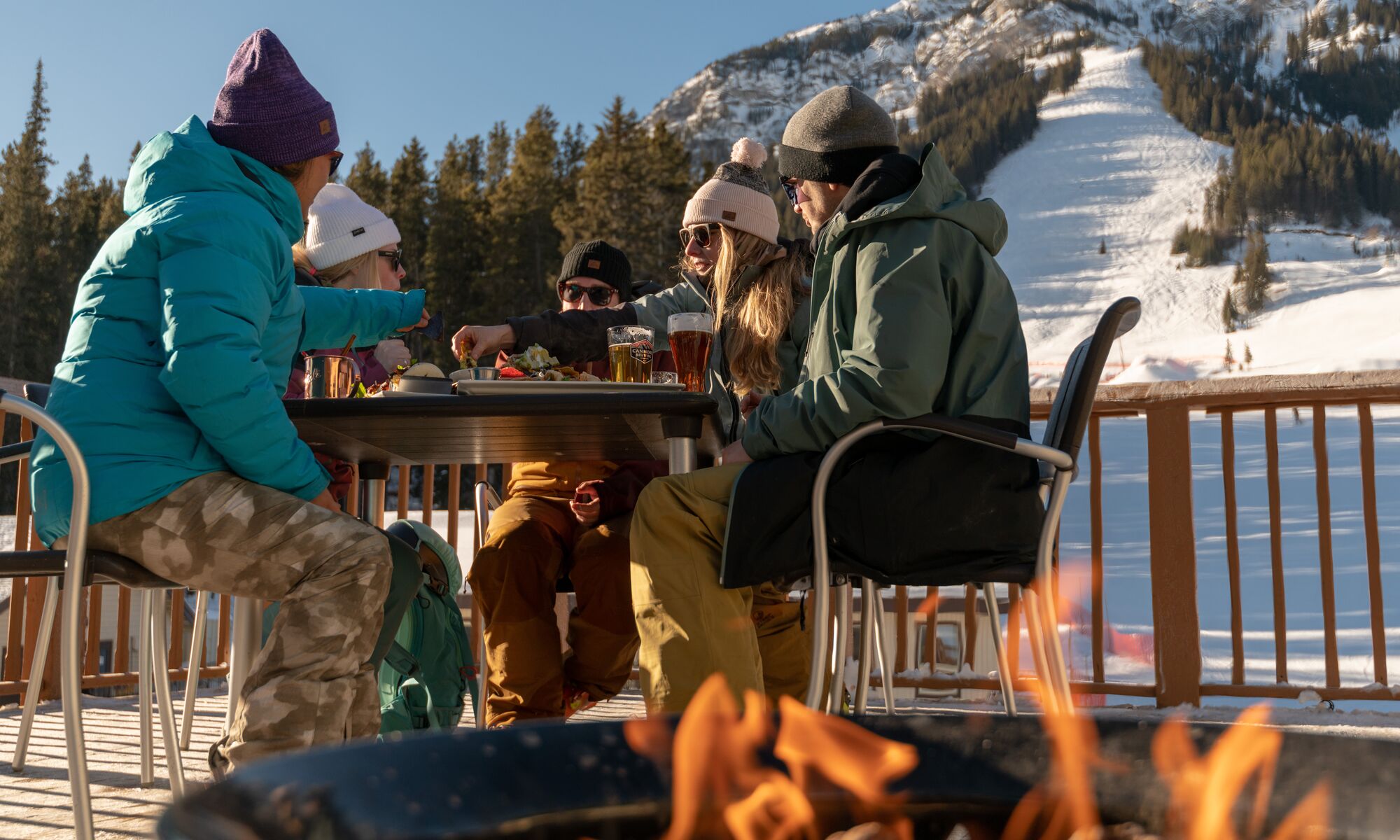 People enjoying food at Lone Pine Lodge on Mt. Norquay in Banff National Park.