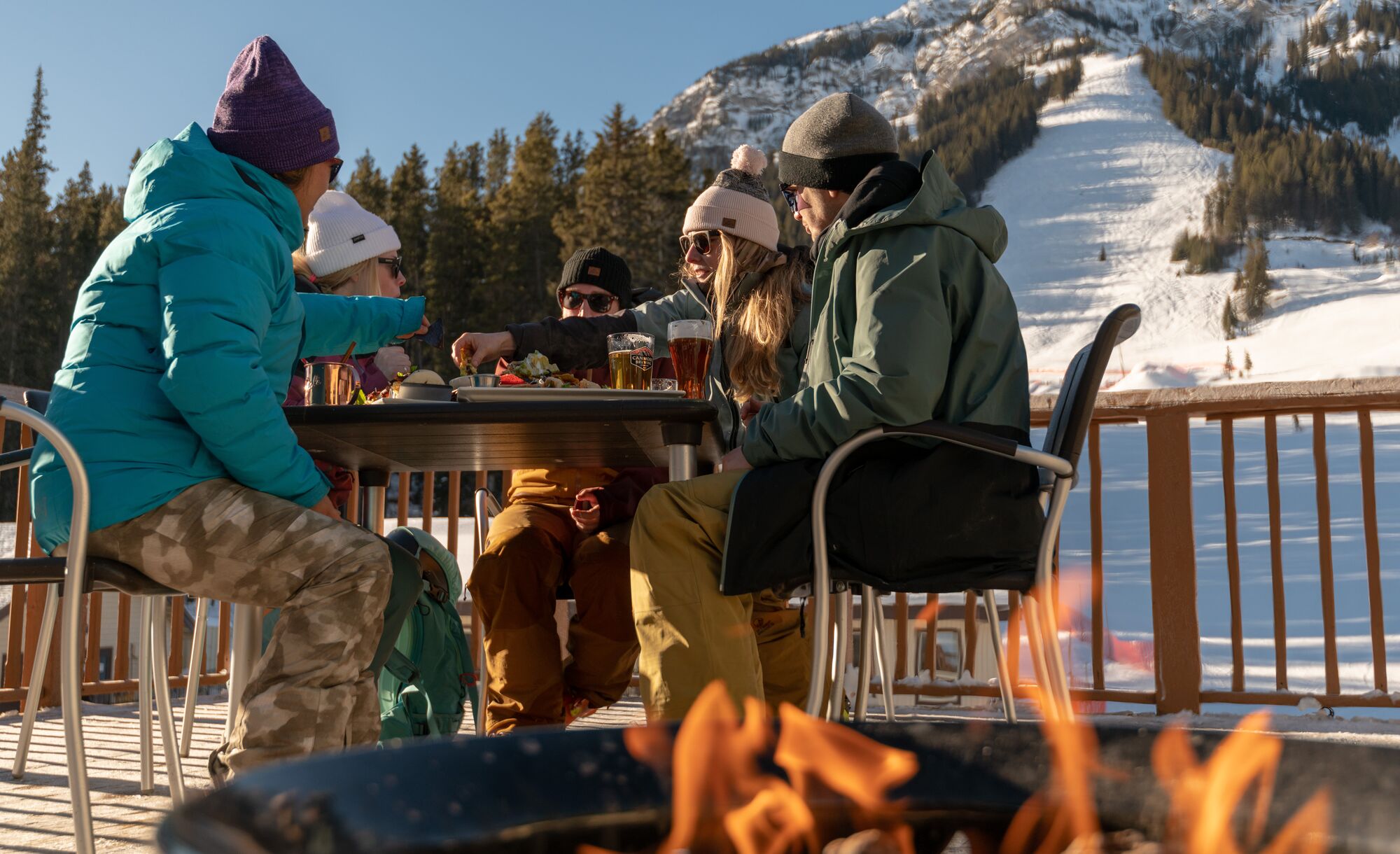 People enjoying food at Lone Pine Lodge on Mt. Norquay in Banff National Park.