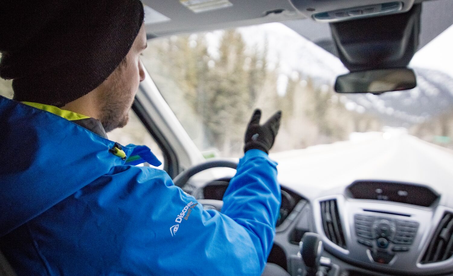 A Discover Banff Tours tour guide drives his tour group through Banff National Park