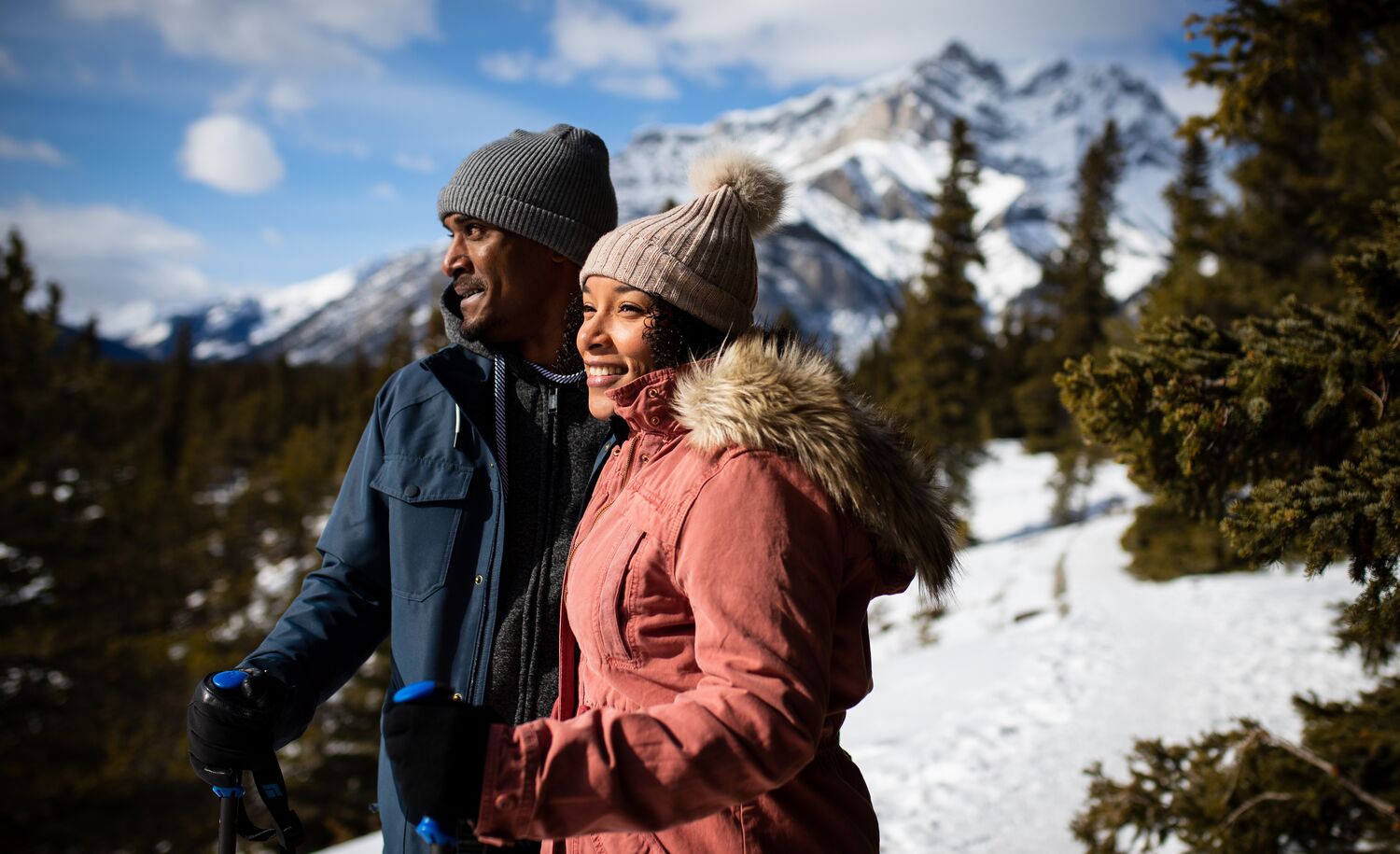 A couple hiking to a viewpoint in Banff National Park in spring