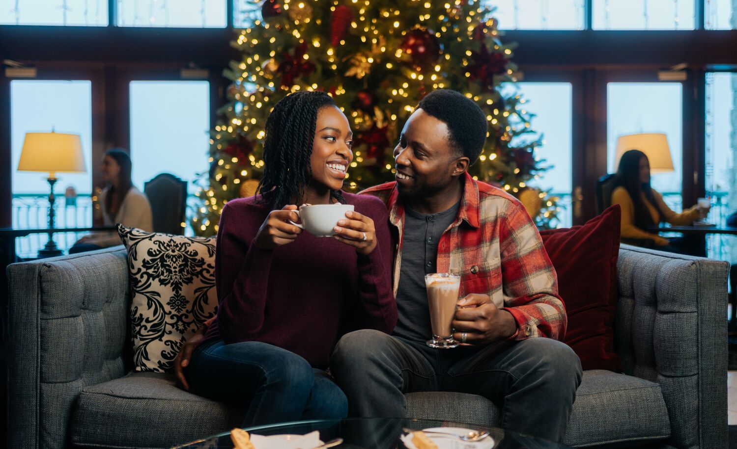 A couple on a couch in Banff at Christmas.