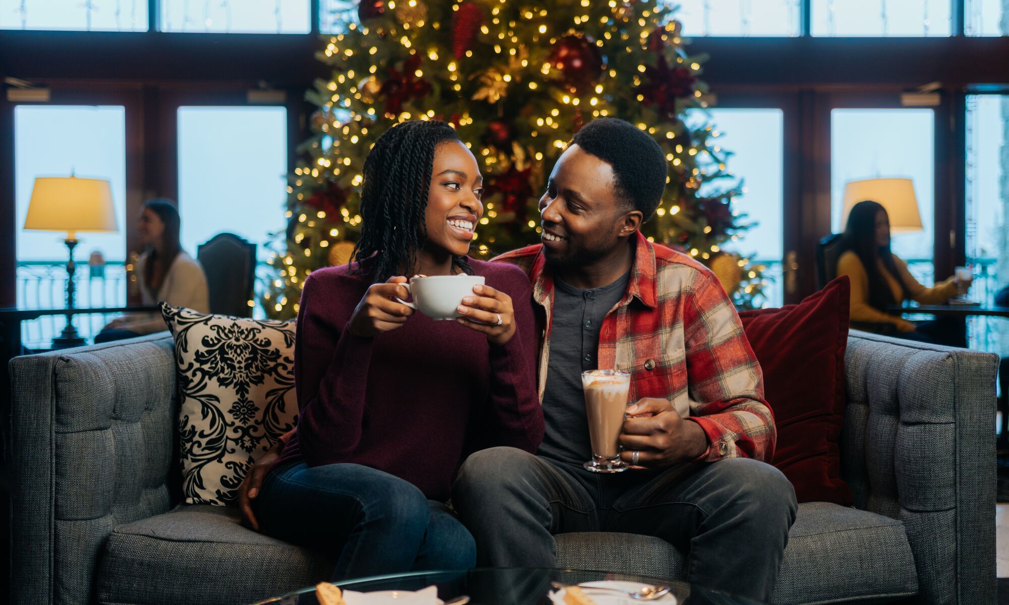 A couple on a couch in Banff at Christmas.