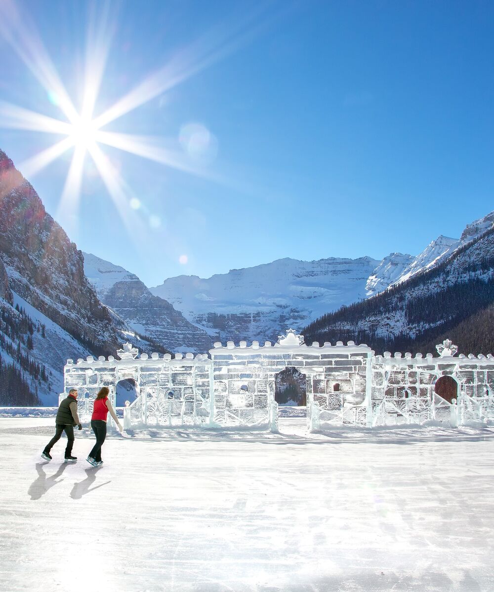A couple or a friends goes ice skating in Fairmont Chateau Lake Louise.