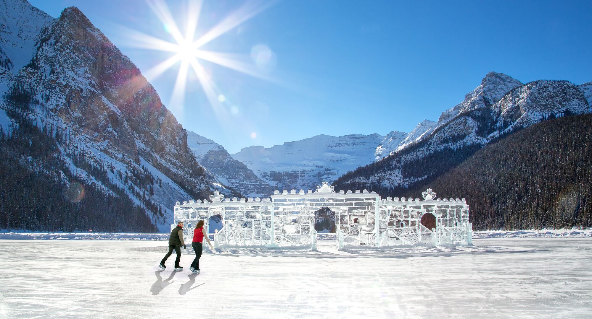 A couple or a friends goes ice skating in Fairmont Chateau Lake Louise.